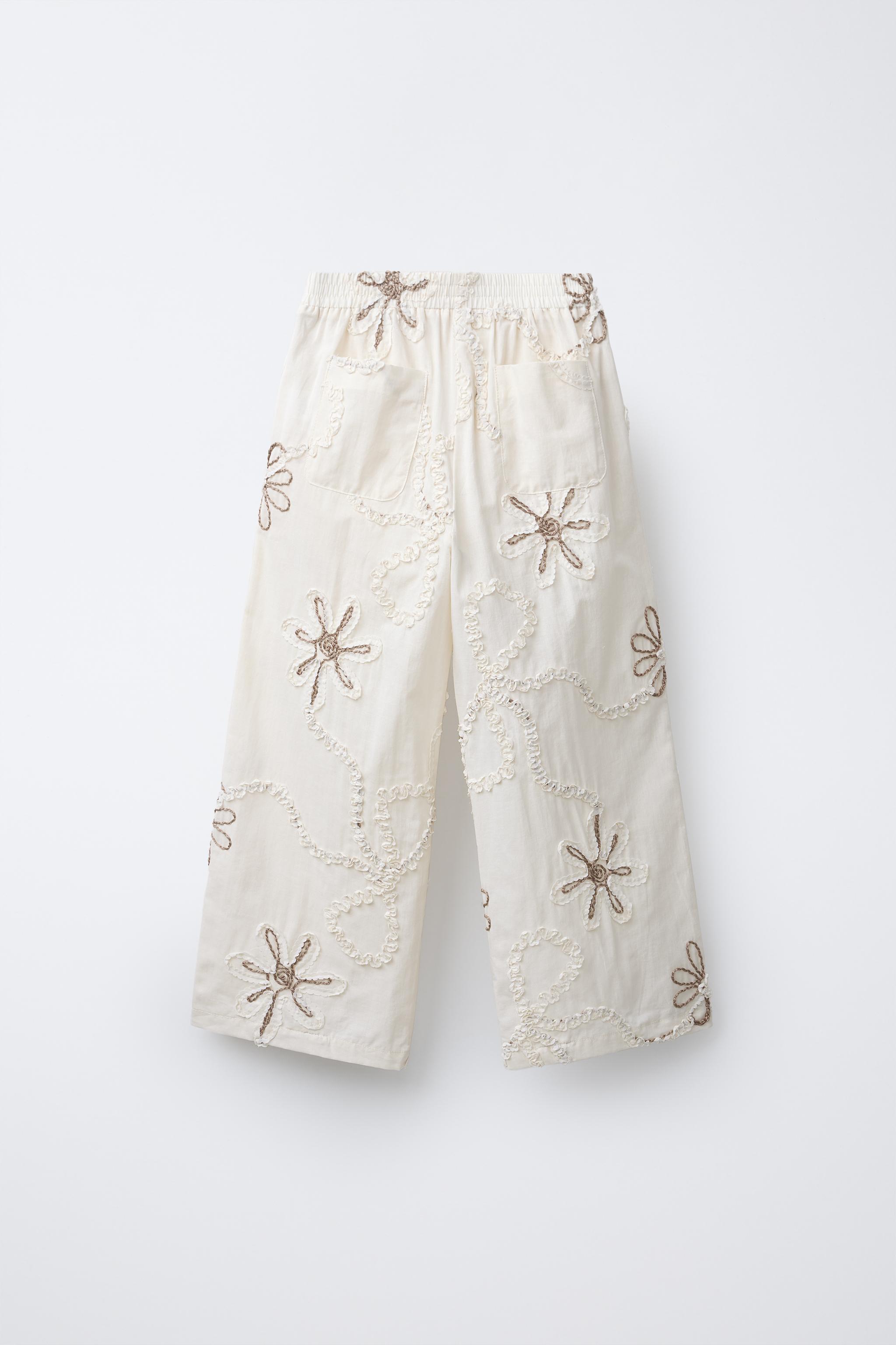 STRAIGHT LEG PANTS WITH EMBROIDERED FLOWERS