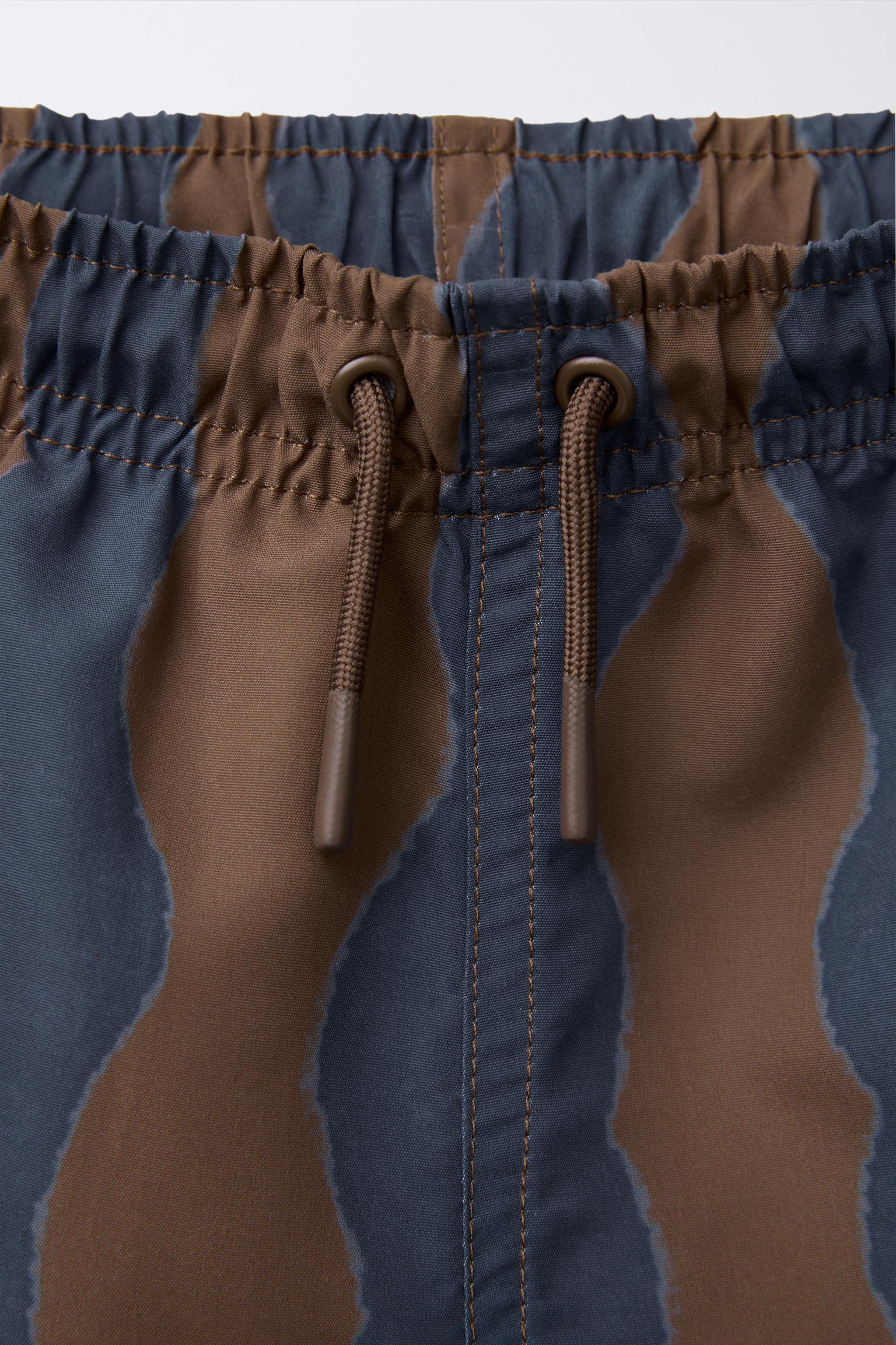 6-14 YEARS/ WAVE PRINT SWIM SHORTS