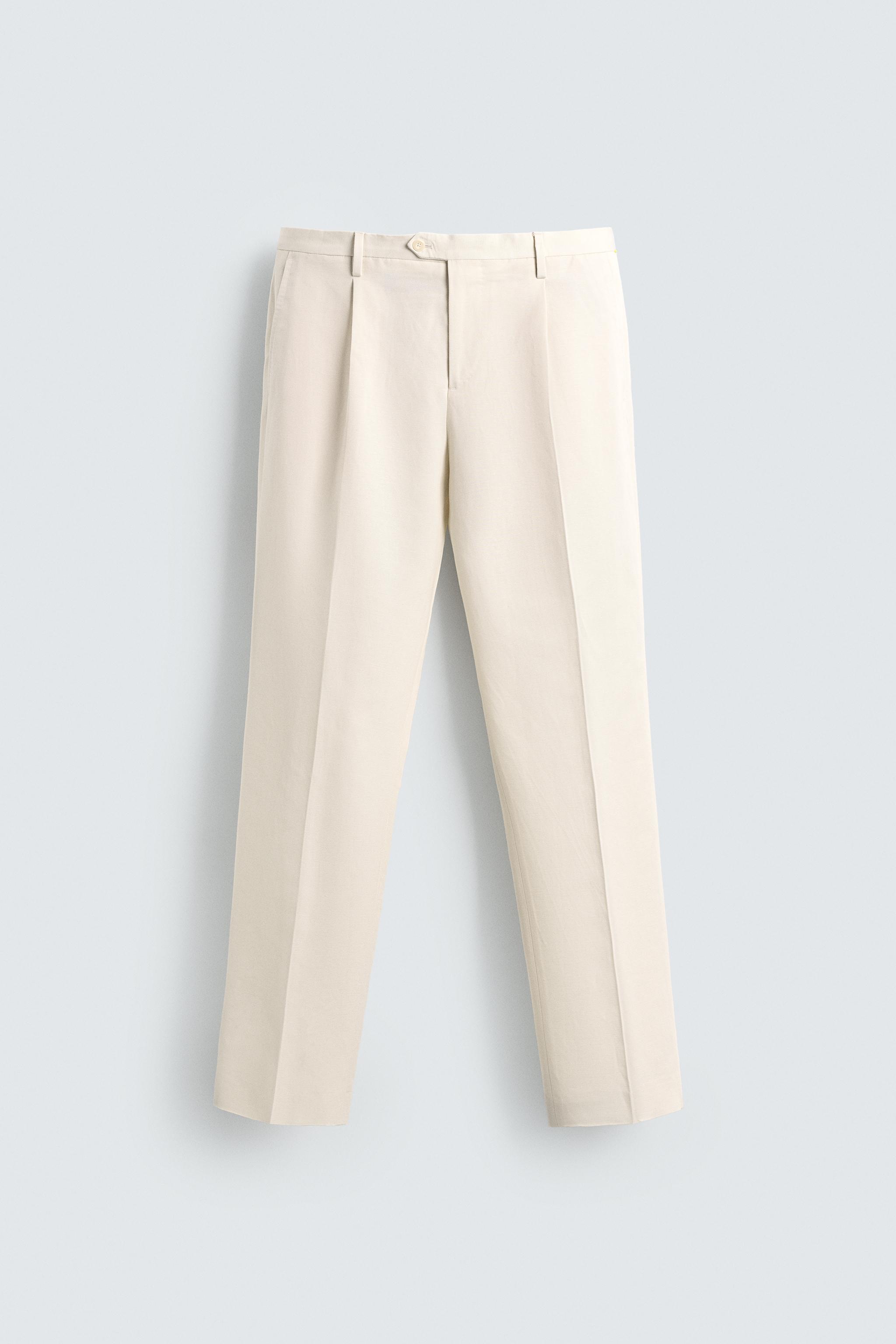 REGULAR FIT PLEATED PANTS