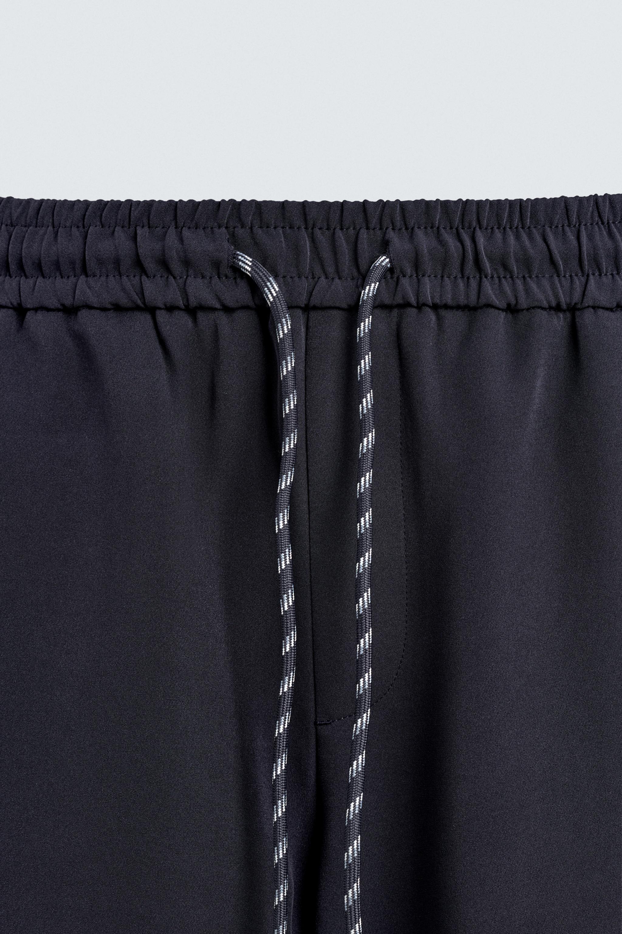 WIDE FIT JOGGER PANTS WITH SIDE STRIPES