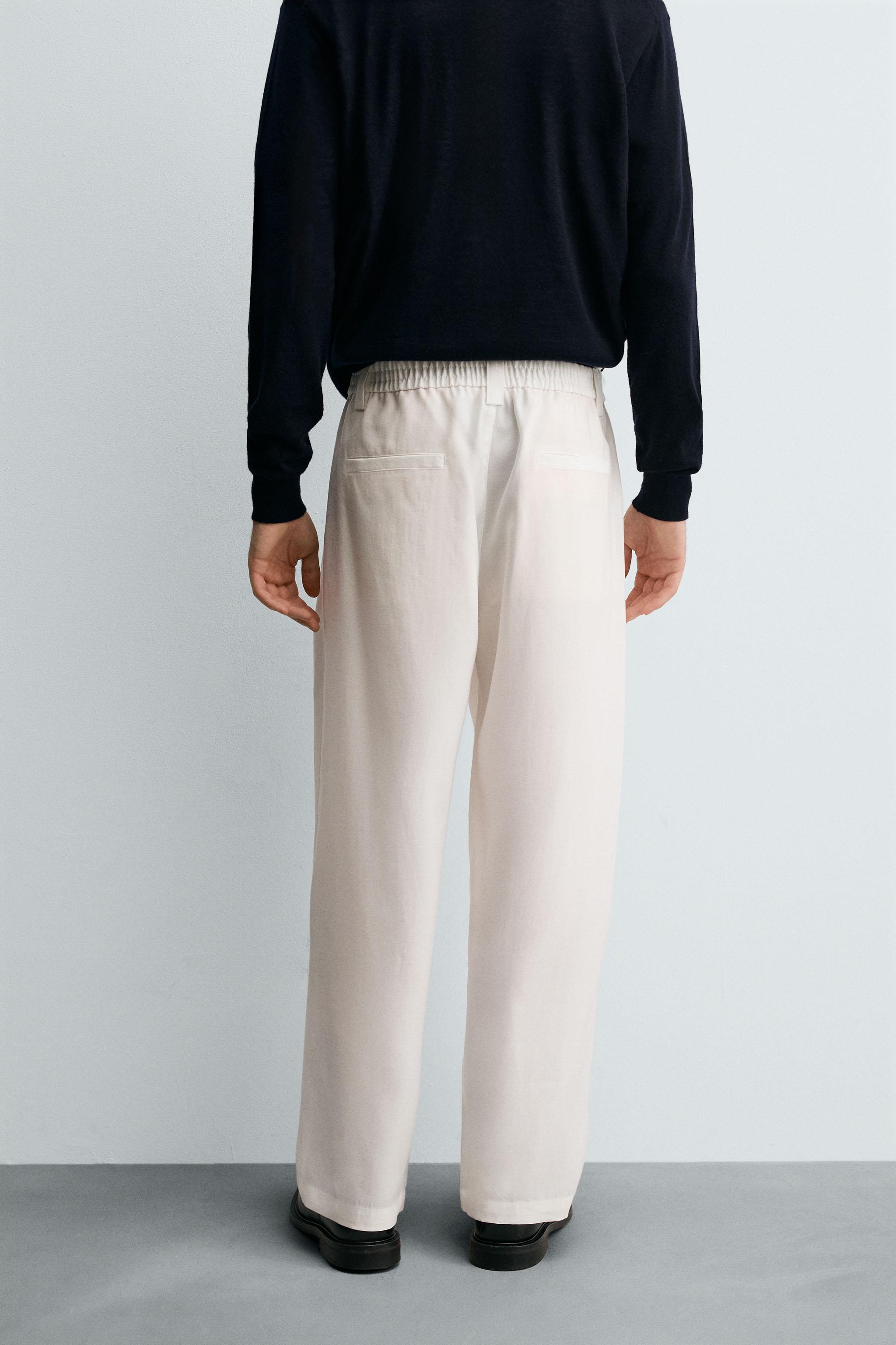 FLOWY PANTS WITH SIDE PLEATS