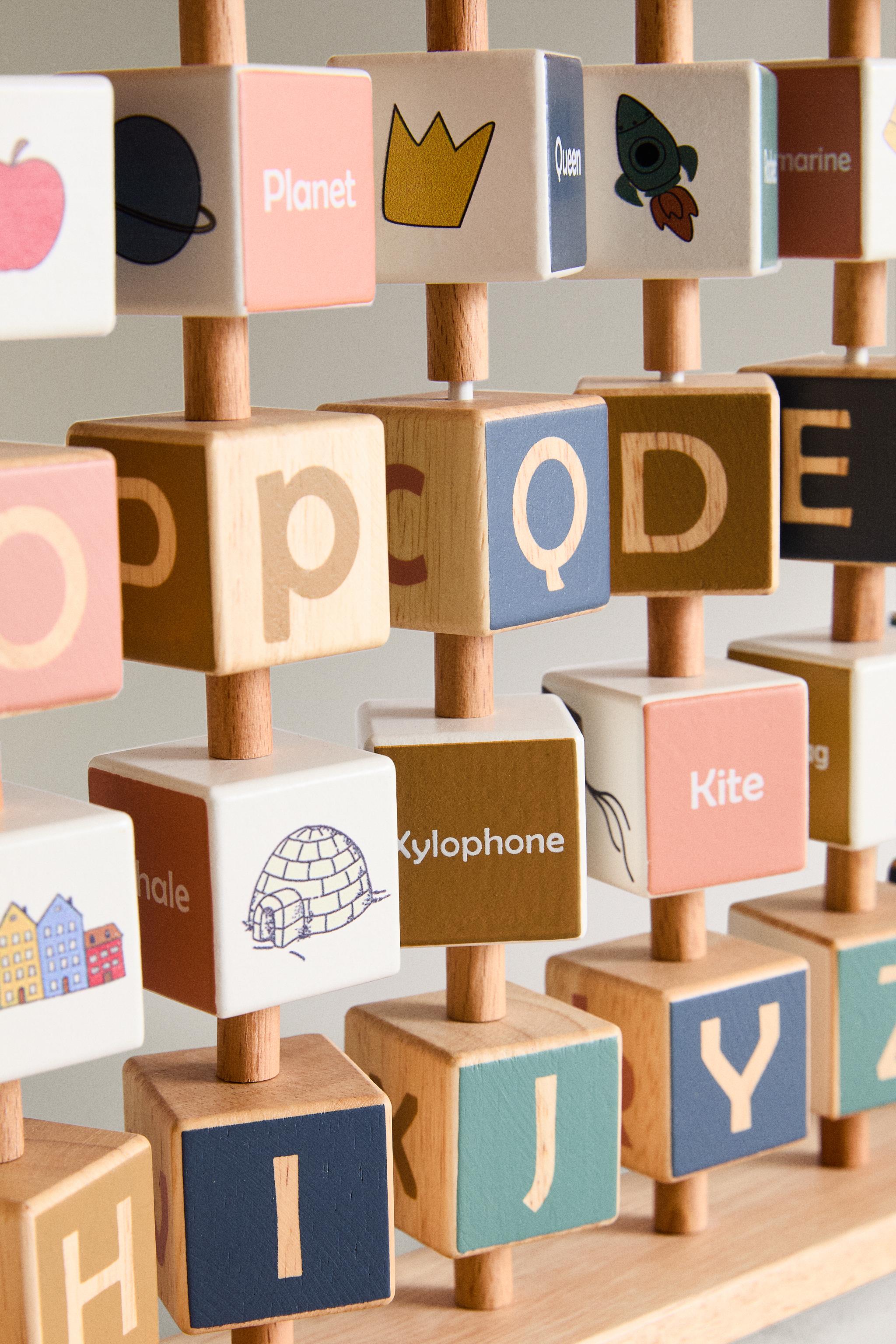 CHILDREN’S WOODEN ALPHABET TOY