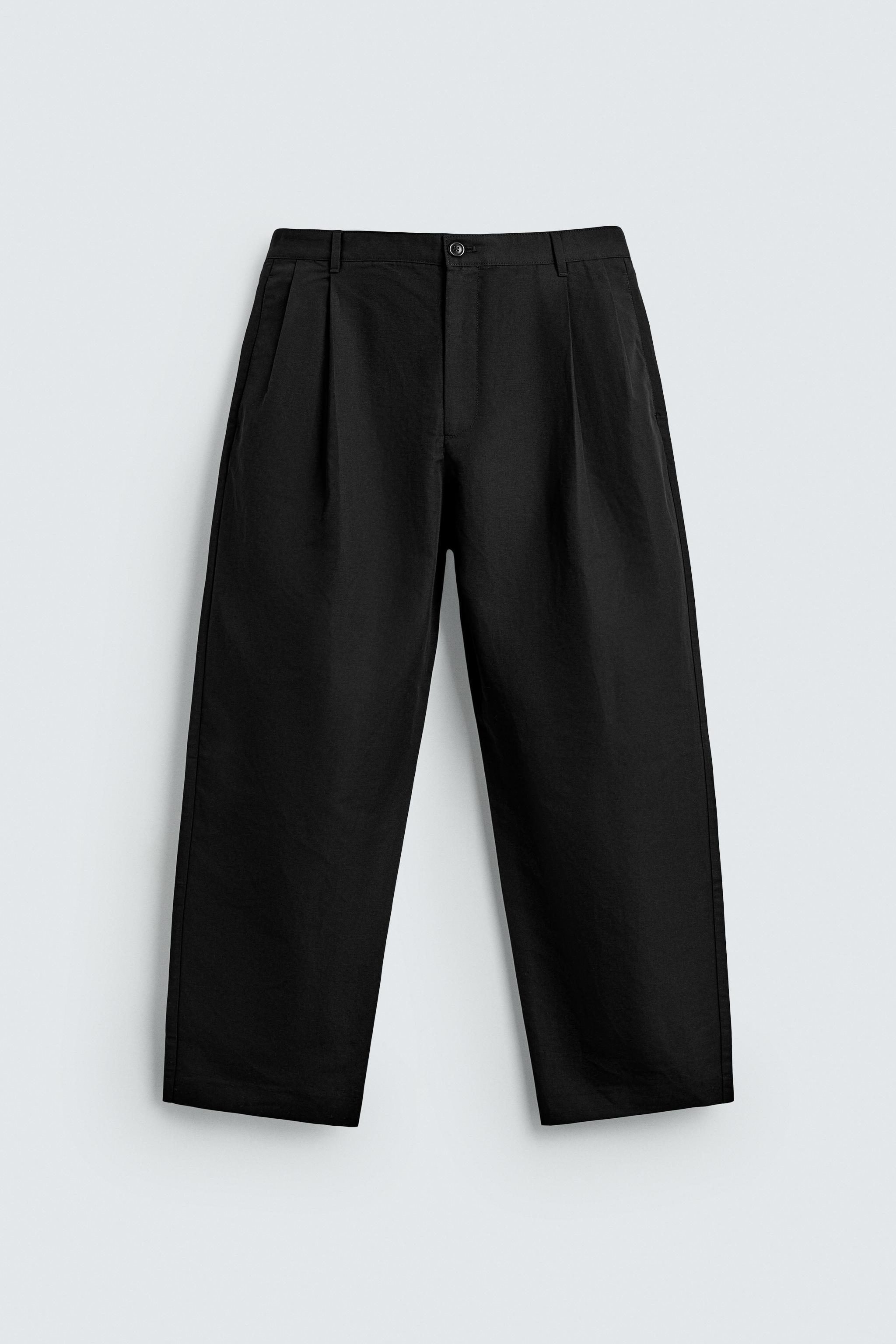 RELAXED FIT PLEATED PANTS