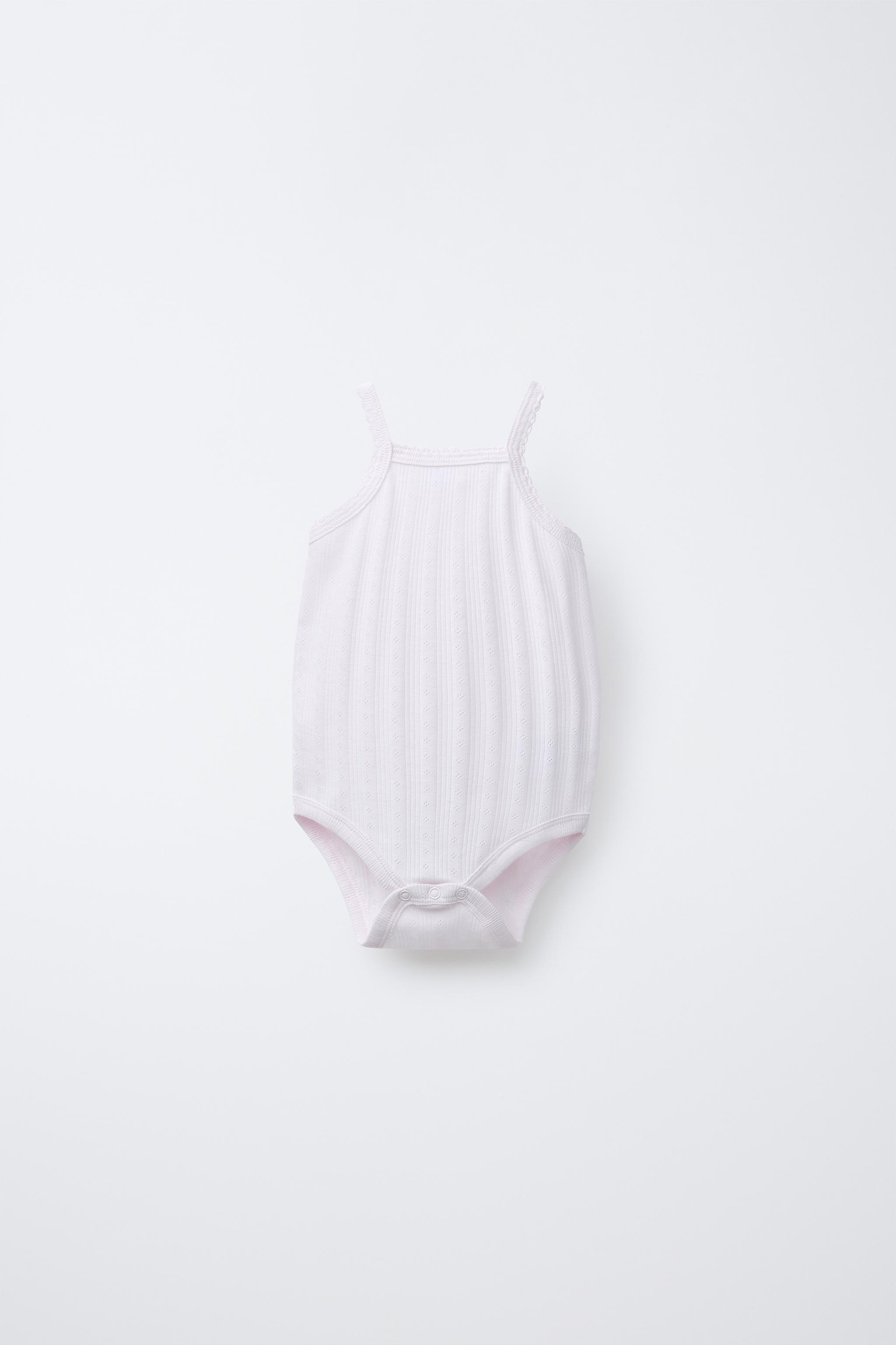 THREE-PACK OF RIB KNIT BODYSUITS WITH CUTOUT DETAIL