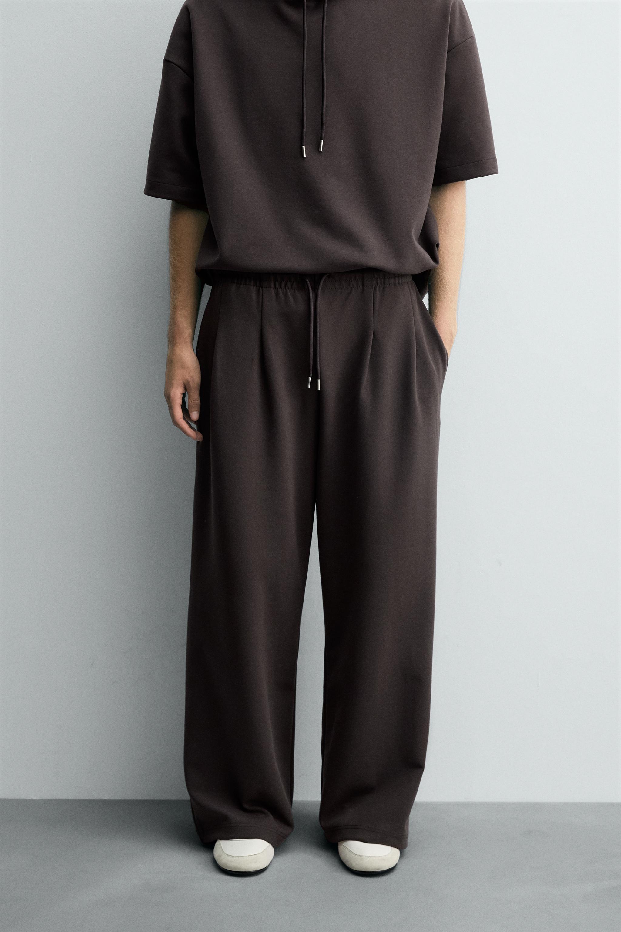 INTERLOCK PLEATED LABEL PANTS