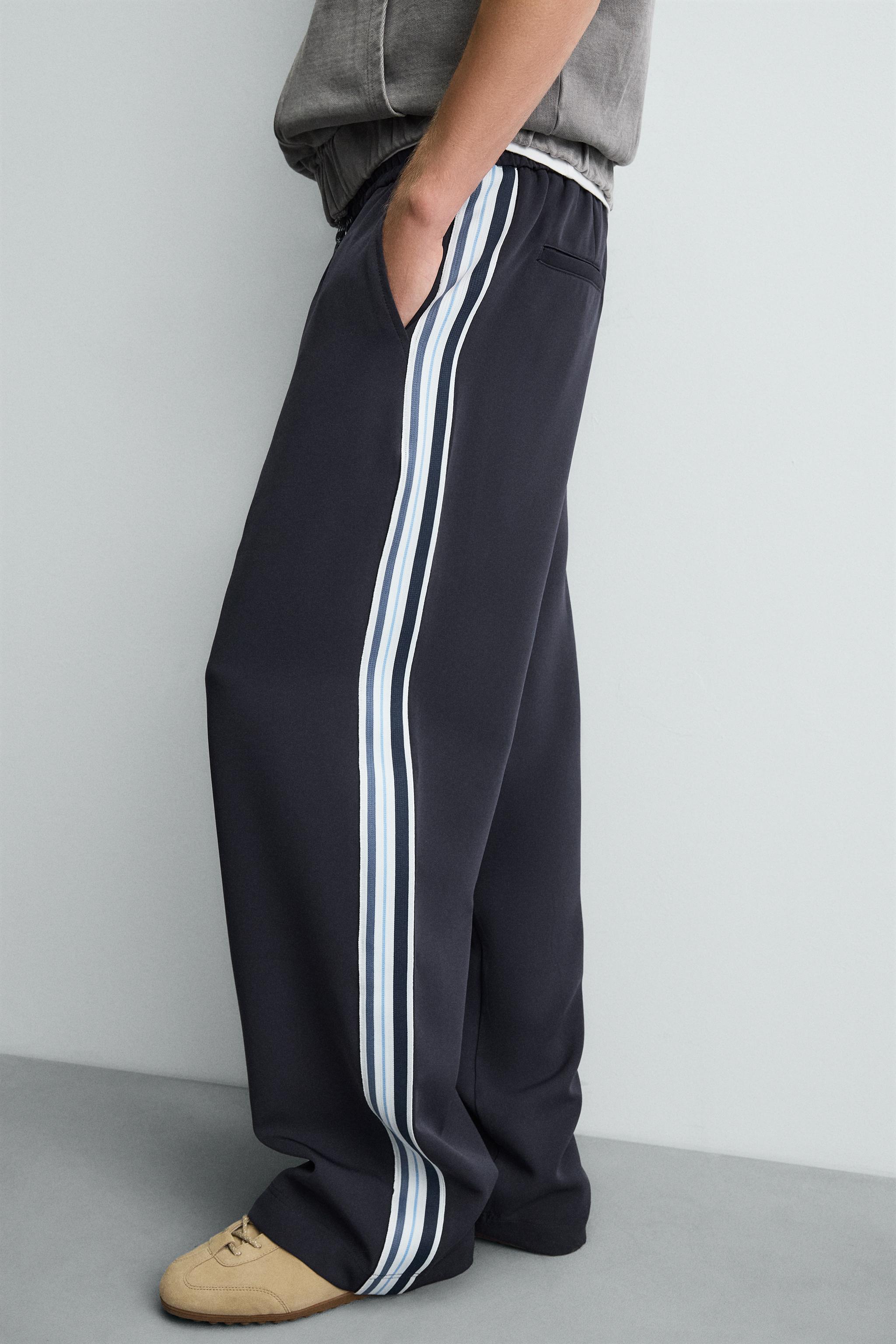 WIDE FIT JOGGER PANTS WITH SIDE STRIPES