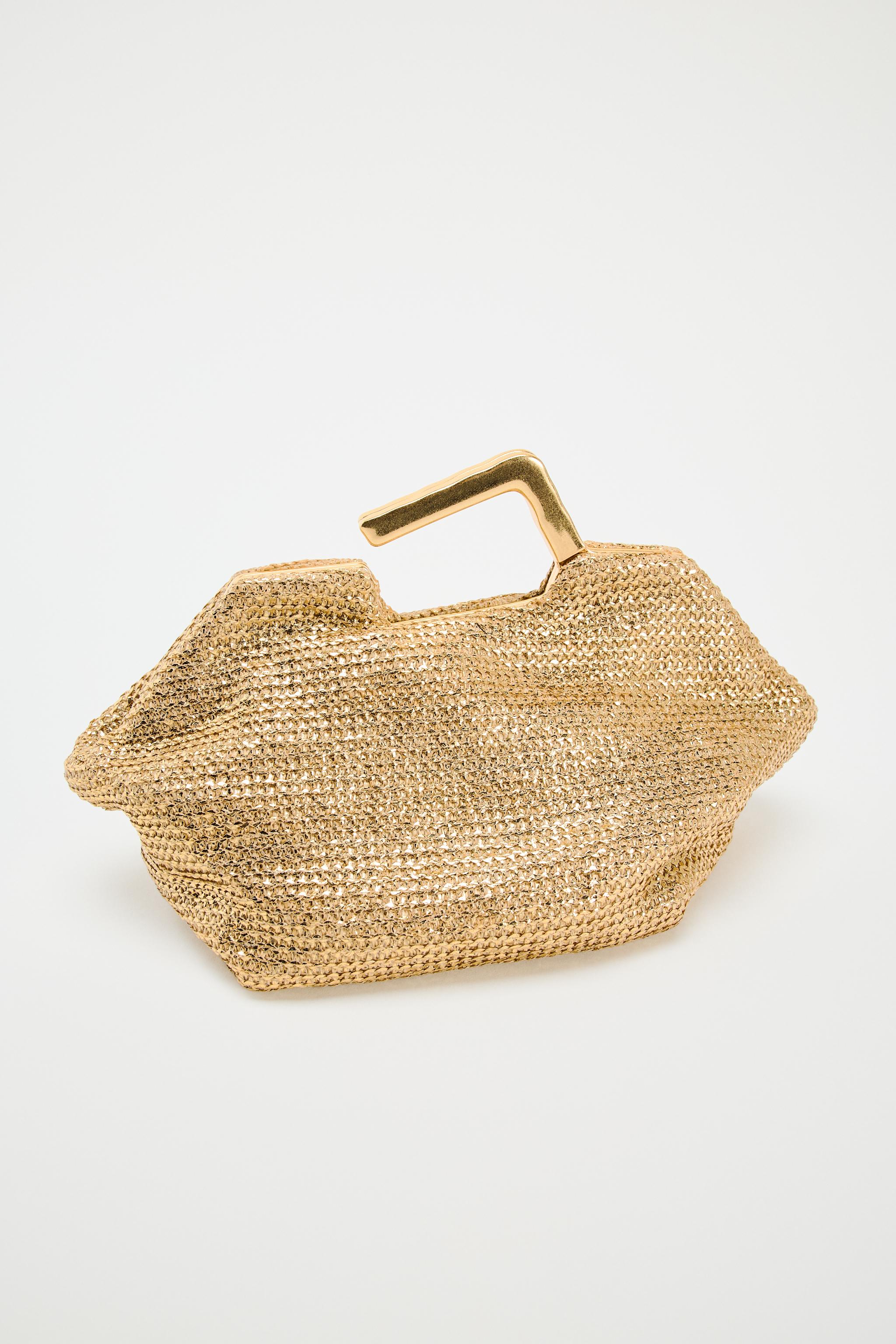 GOLD BAG WITH METAL HANDLE