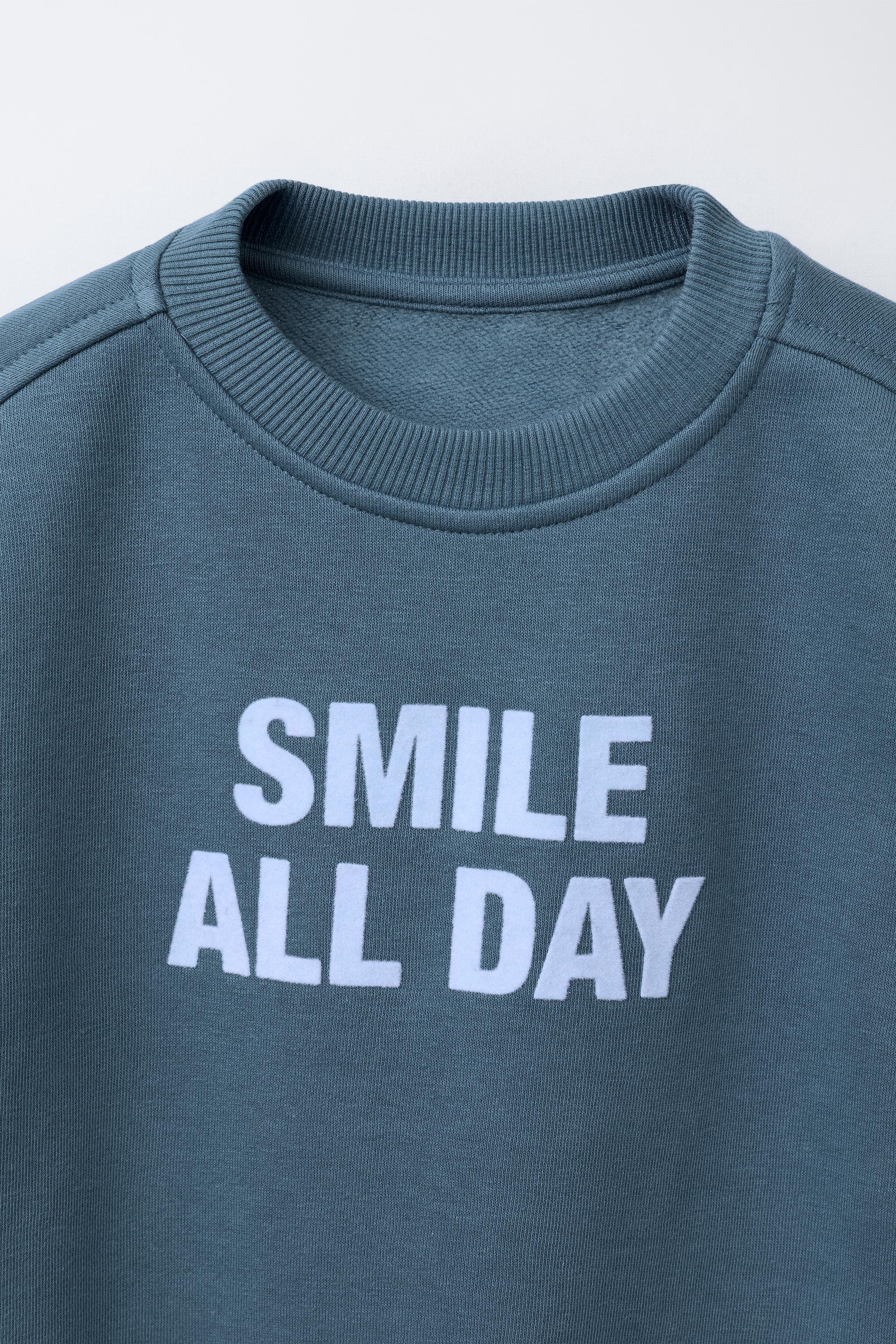 FLOCKED TEXT SWEATSHIRT