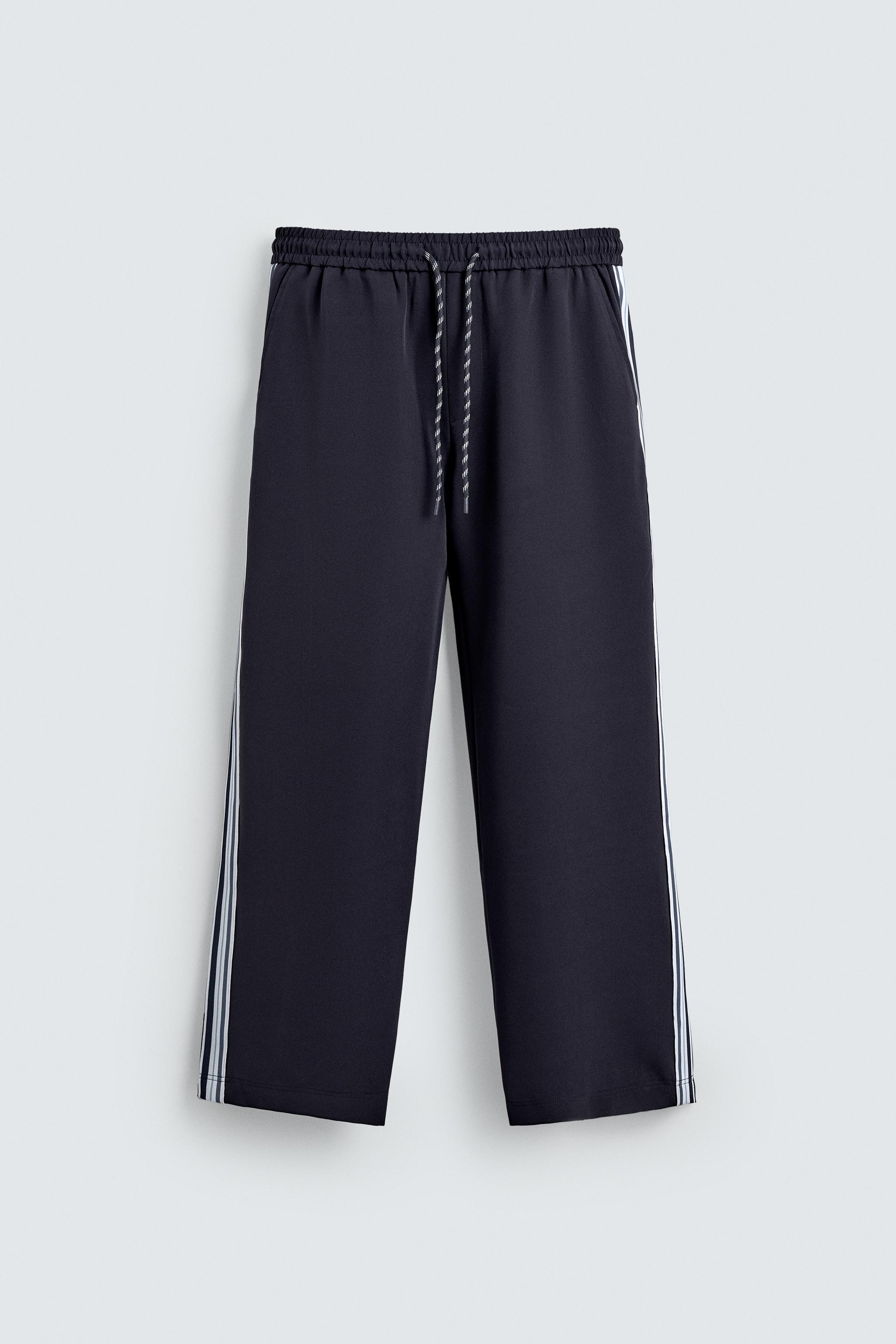 WIDE FIT JOGGER PANTS WITH SIDE STRIPES