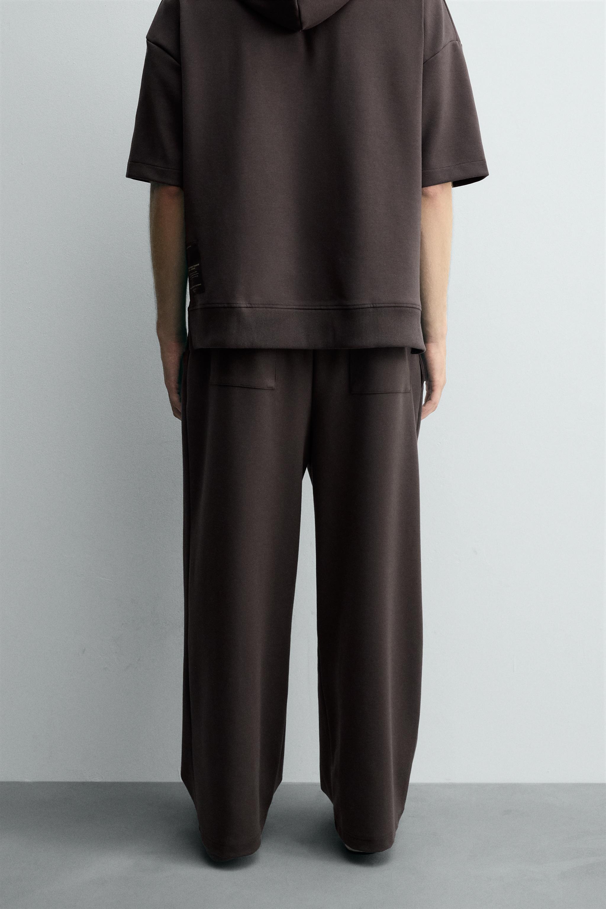 INTERLOCK PLEATED LABEL PANTS