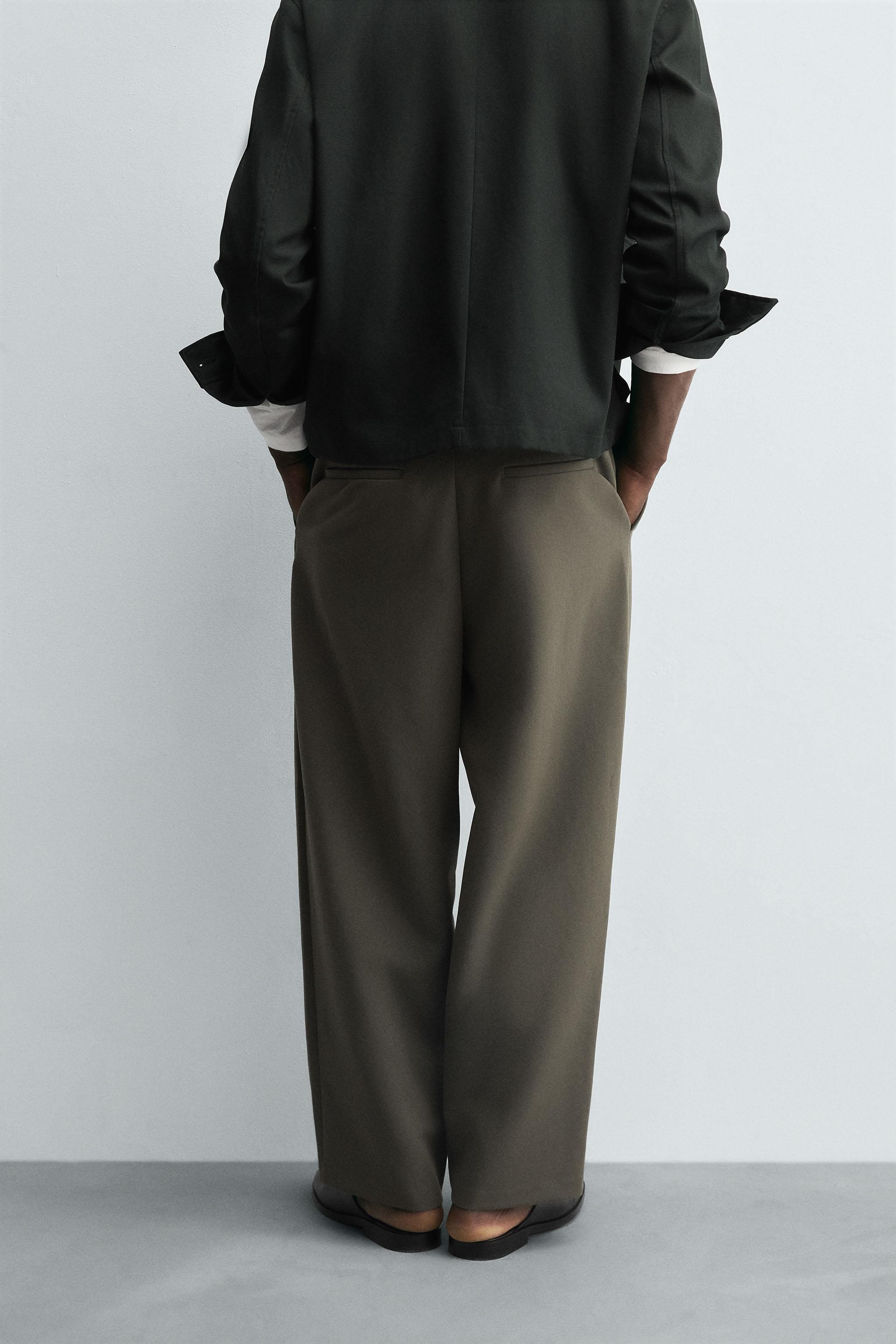 RELAXED FIT PLEATED PANTS