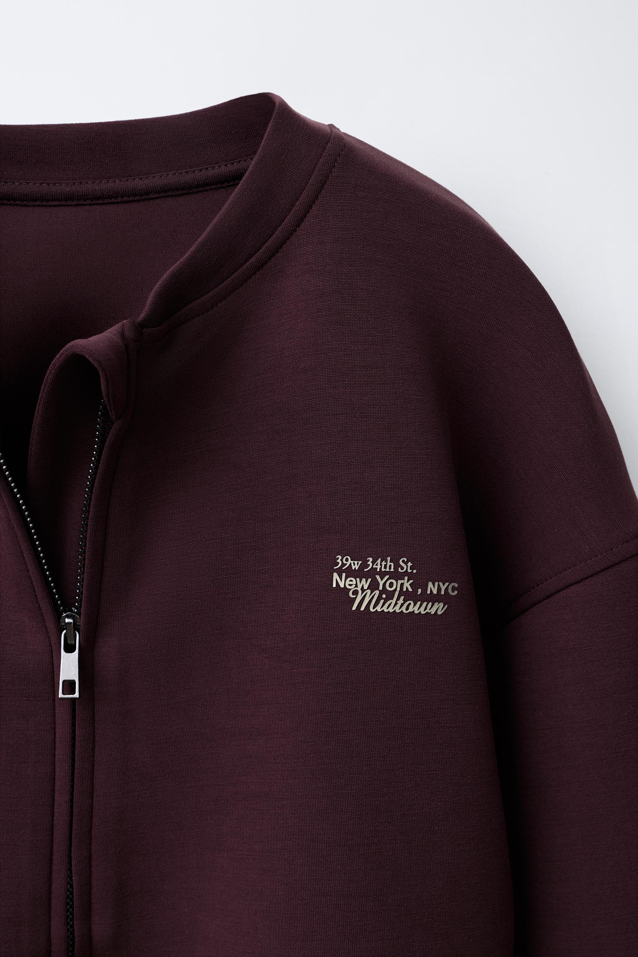 BOMBER JACKET WITH MODAL EMBOSSED TEXT