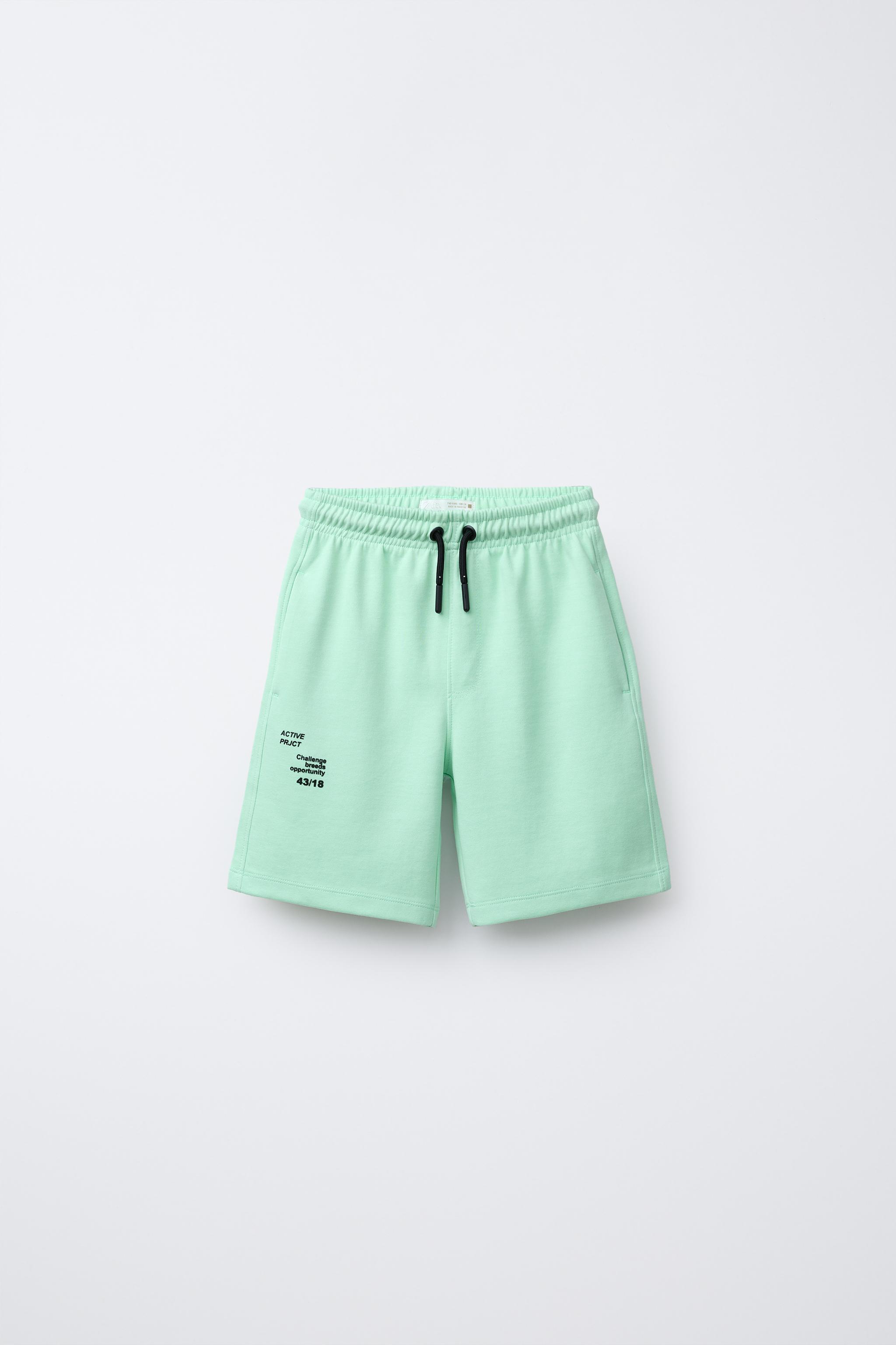 ATHLETIC SHORTS WITH RAISED TEXT