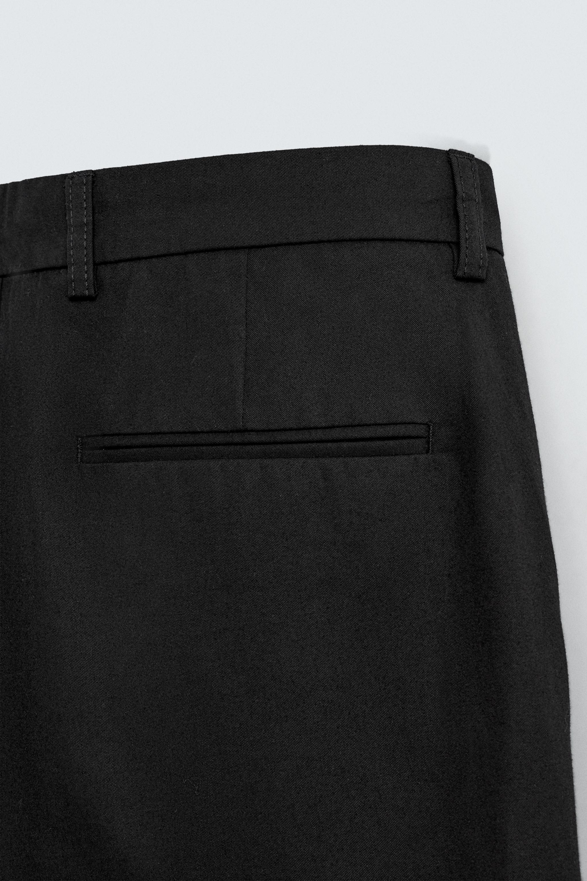 PLEATED WIDE FIT PANTS