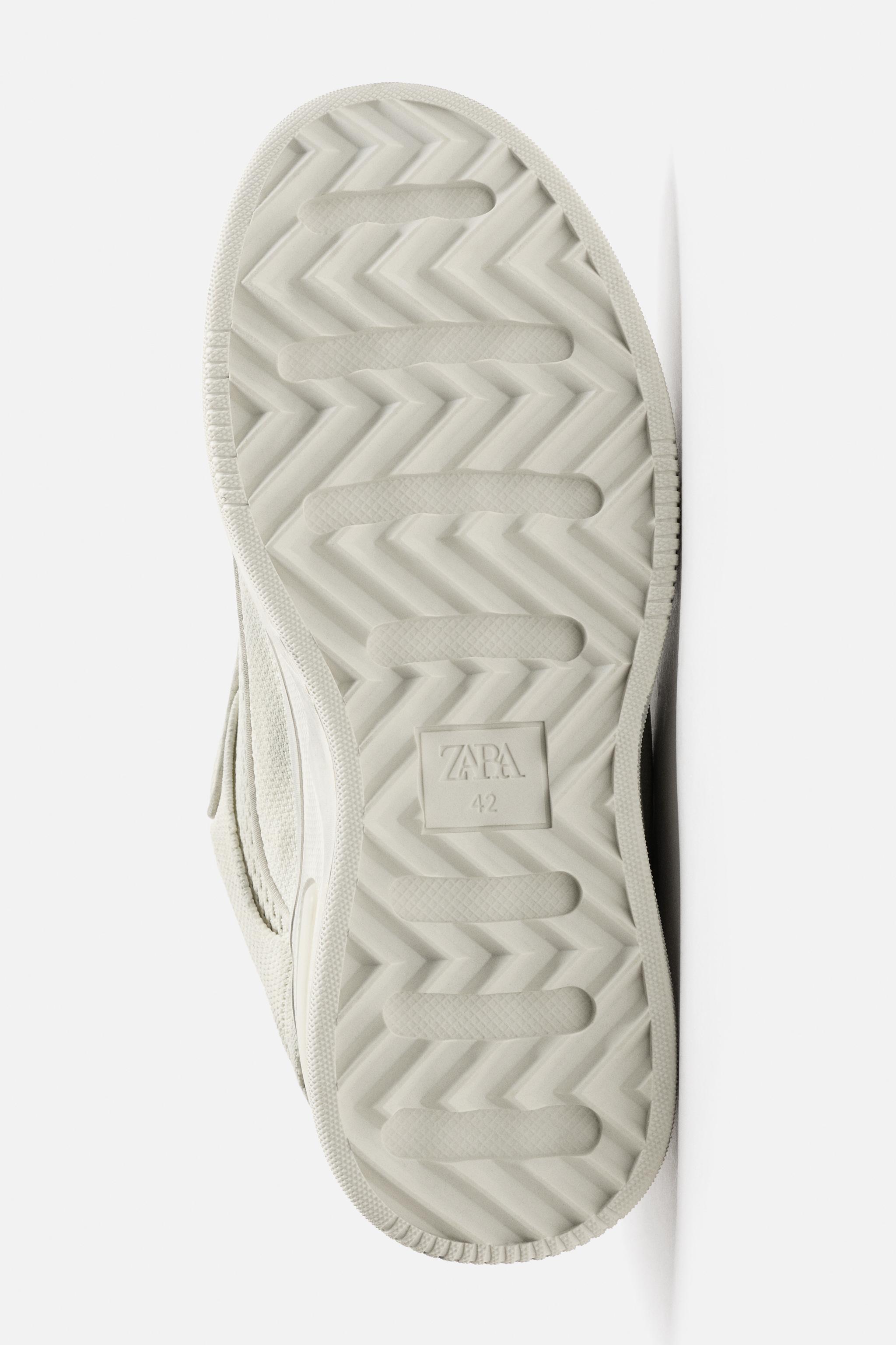 DISTRESSED THICK-SOLED SNEAKERS