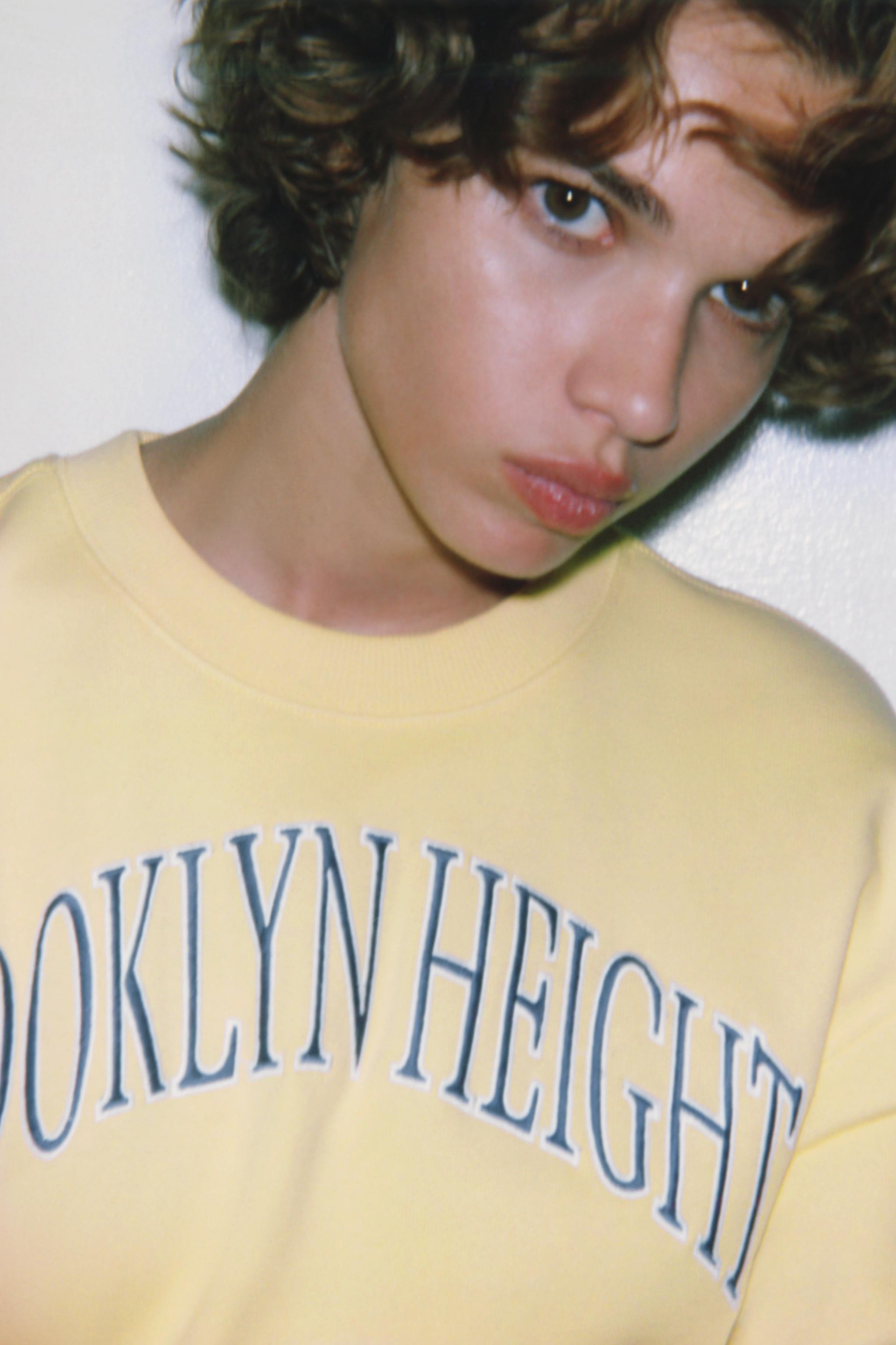 EMBROIDERED TEXT PLUSH SWEATSHIRT