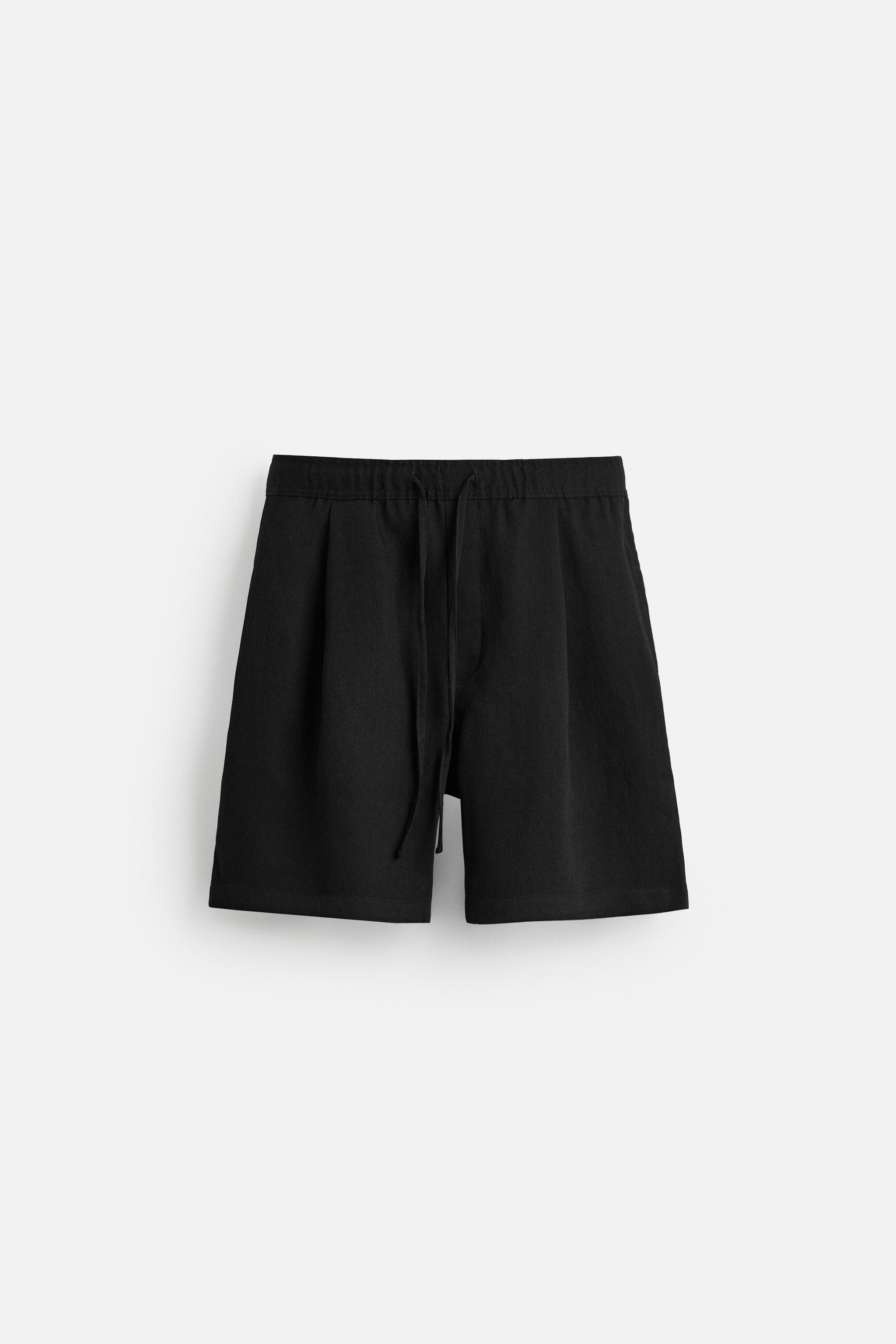 PLEATED FLOWY SHORTS