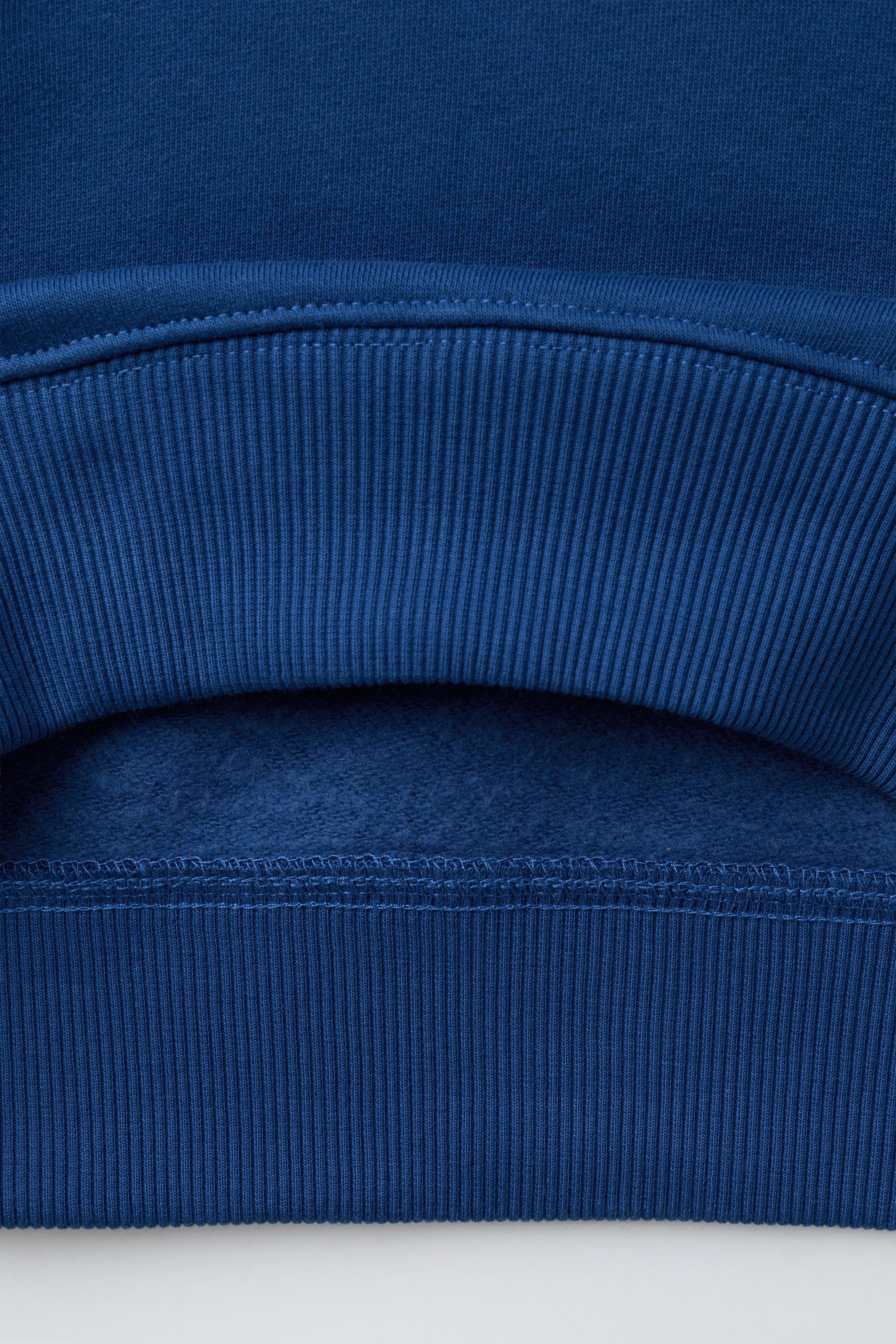 EMBROIDERED POCKET SWEATSHIRT