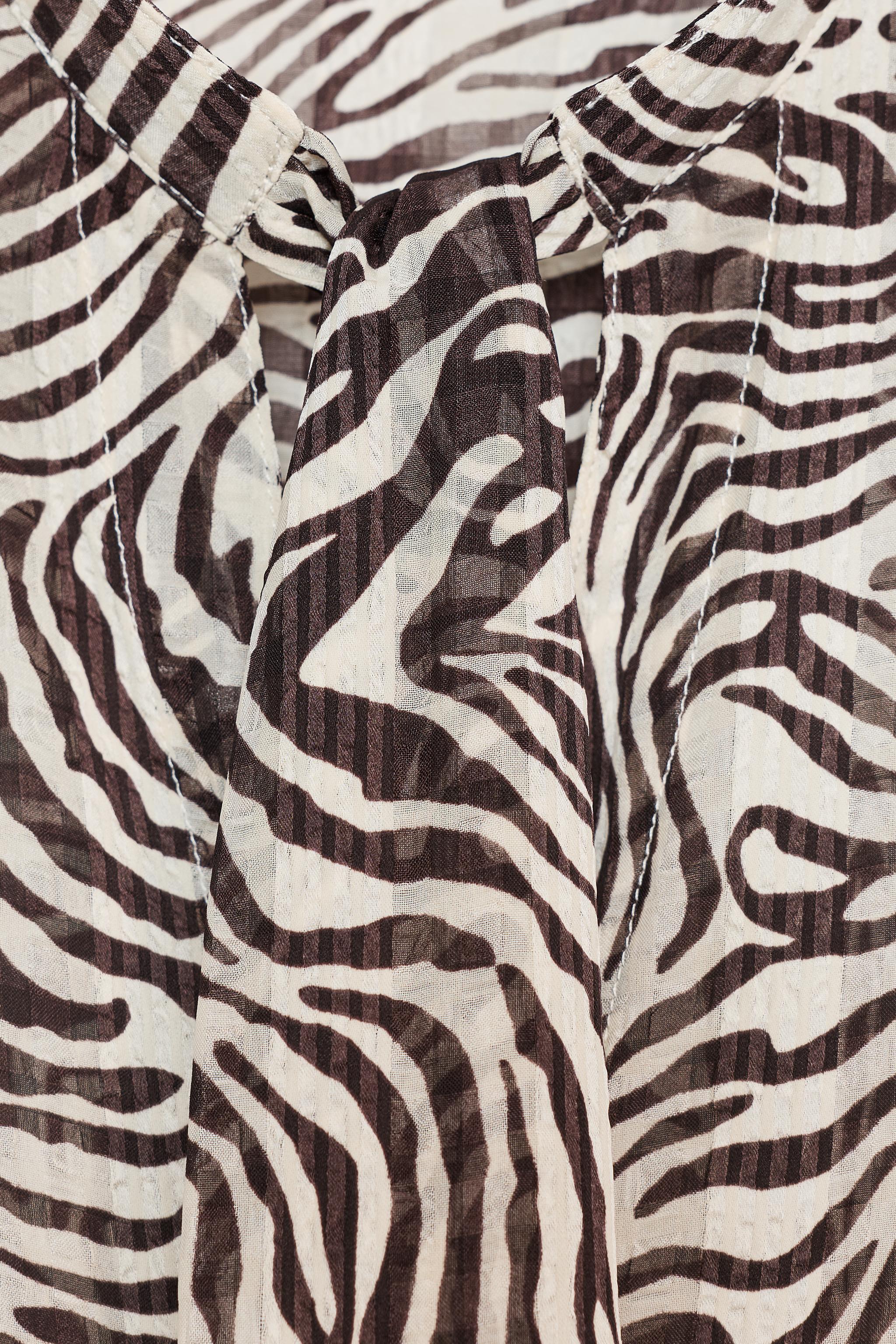 ANIMAL PRINT BOW BLOUSE