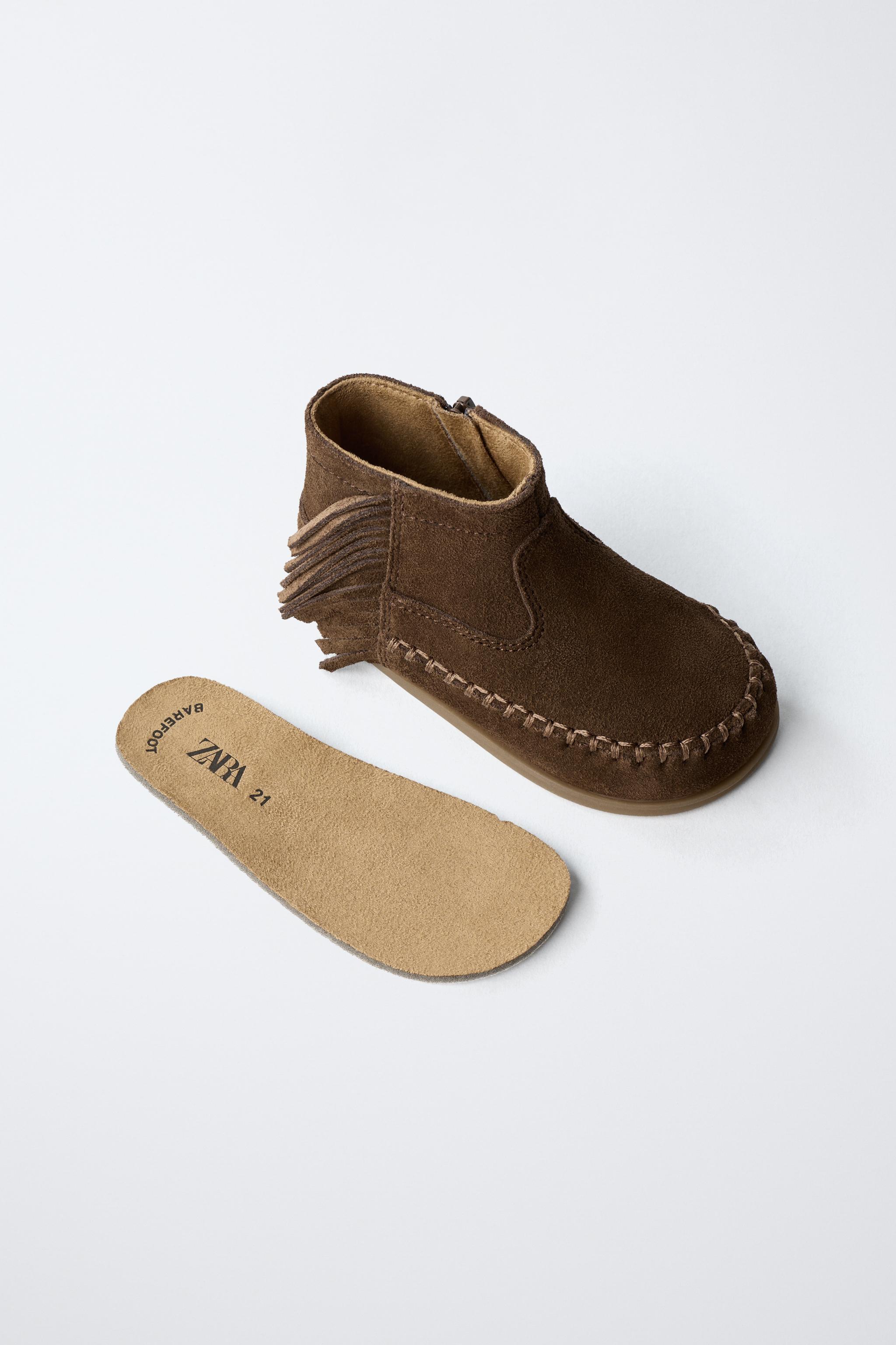 FRINGED LEATHER BOOTS