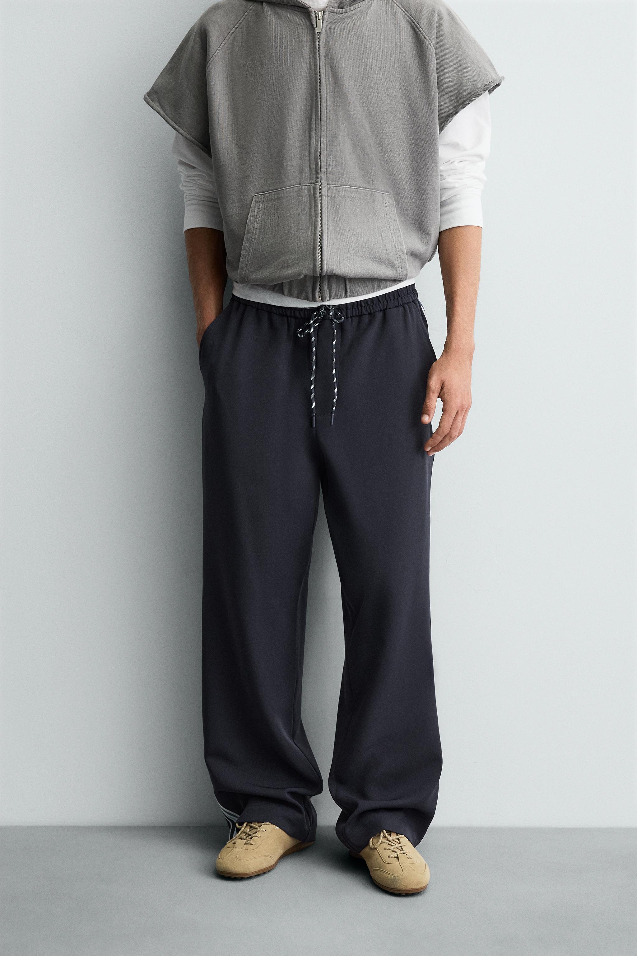 WIDE FIT JOGGER PANTS WITH SIDE STRIPES