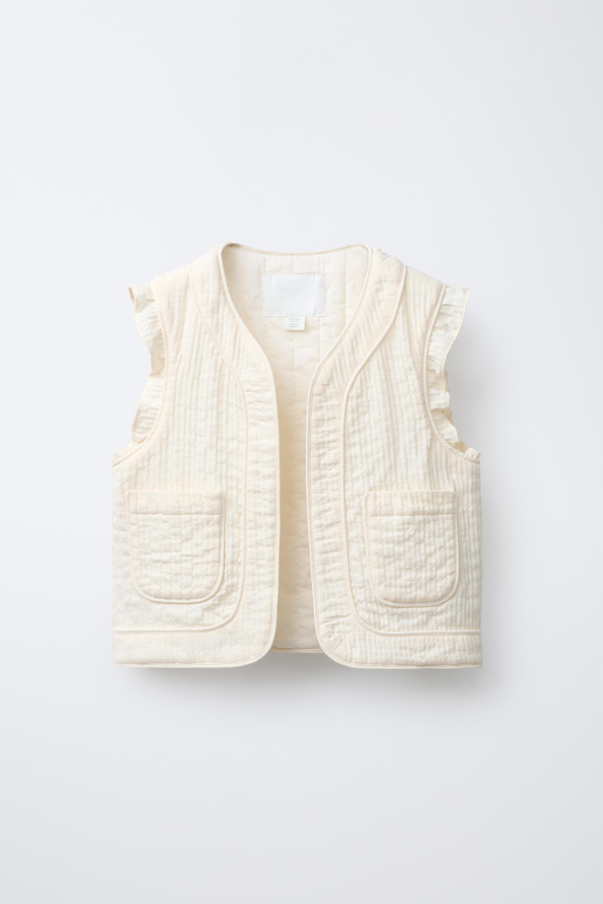 TEXTURED RUFFLE VEST