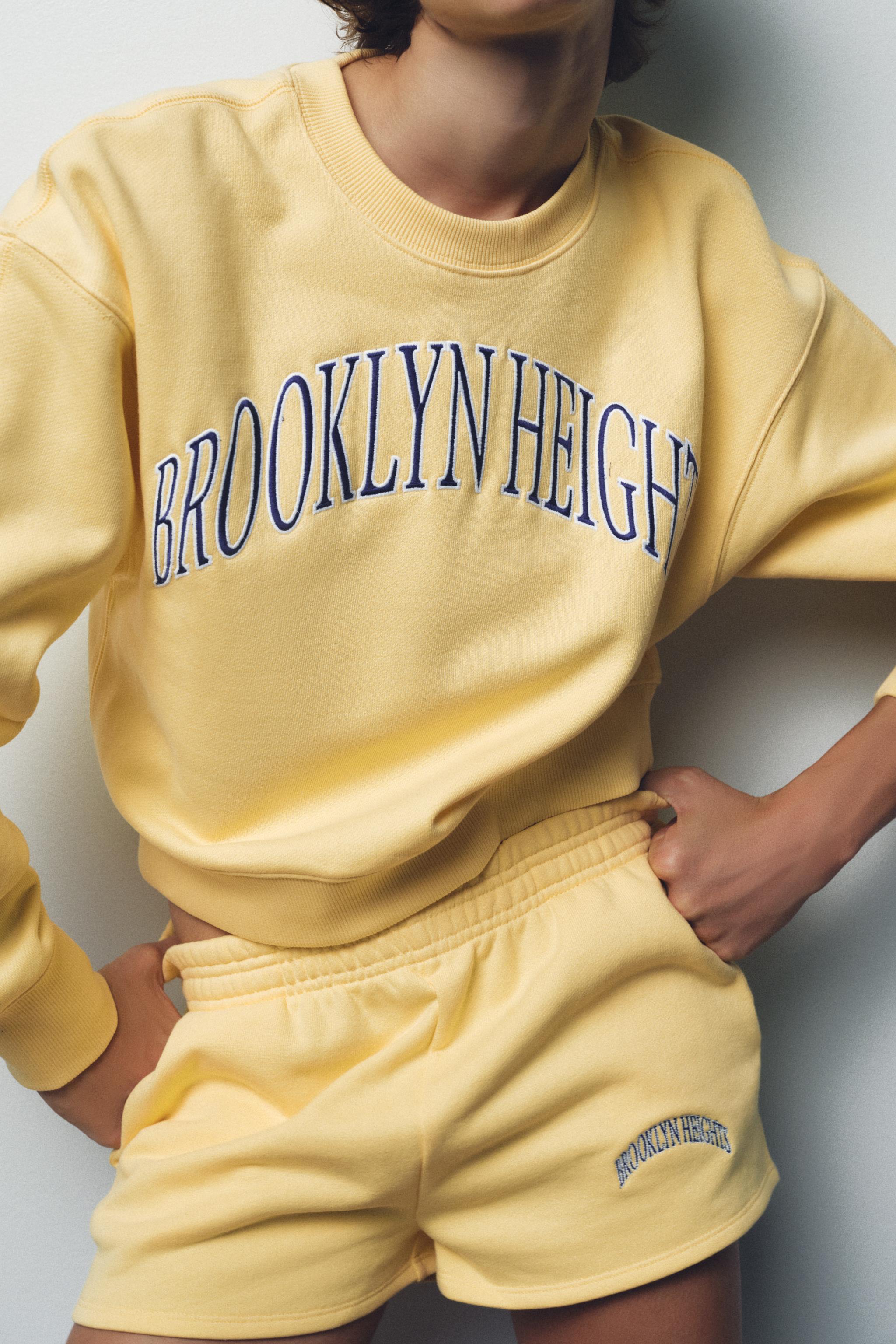 EMBROIDERED TEXT PLUSH SWEATSHIRT