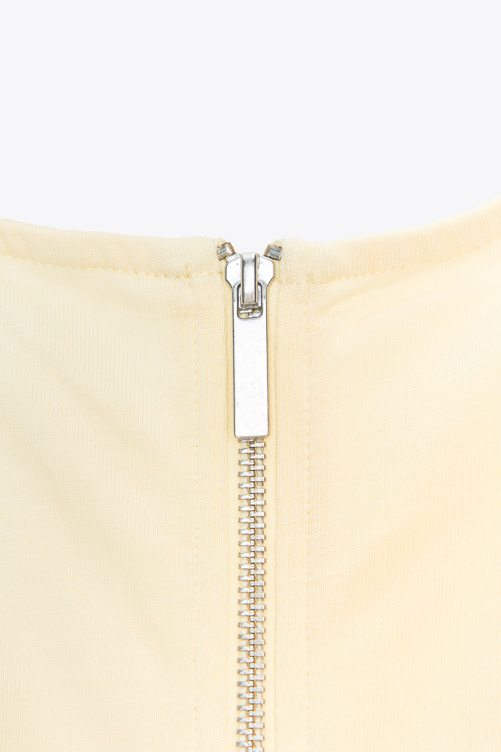 PLEATED ZIP TOP