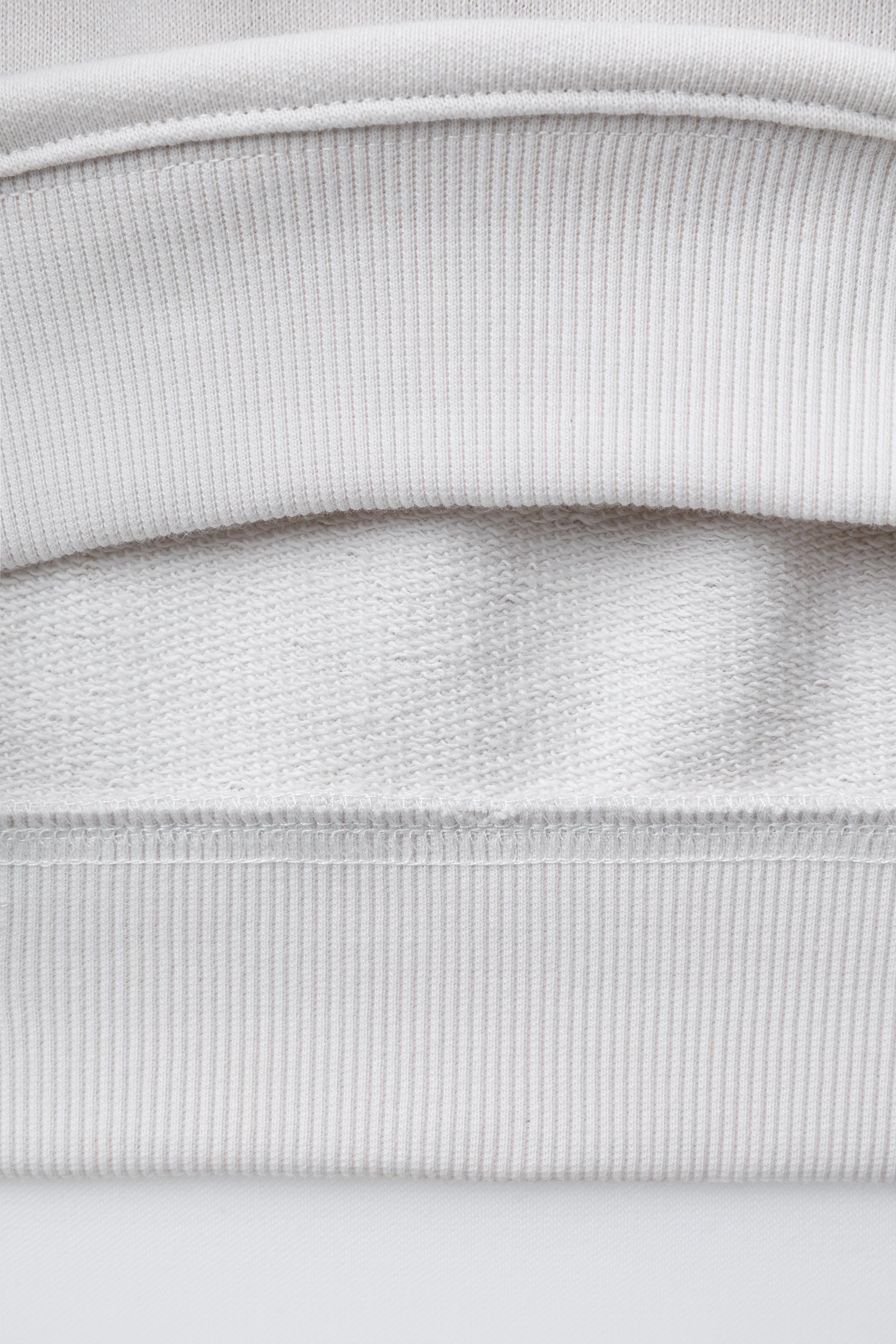 SHORT SLEEVE TEXT SWEATSHIRT