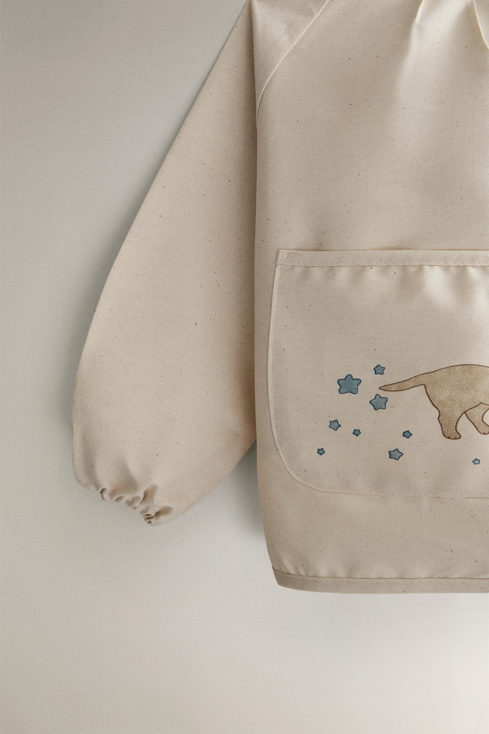 CHILDREN'S SKATING DOG BIB WITH SLEEVES