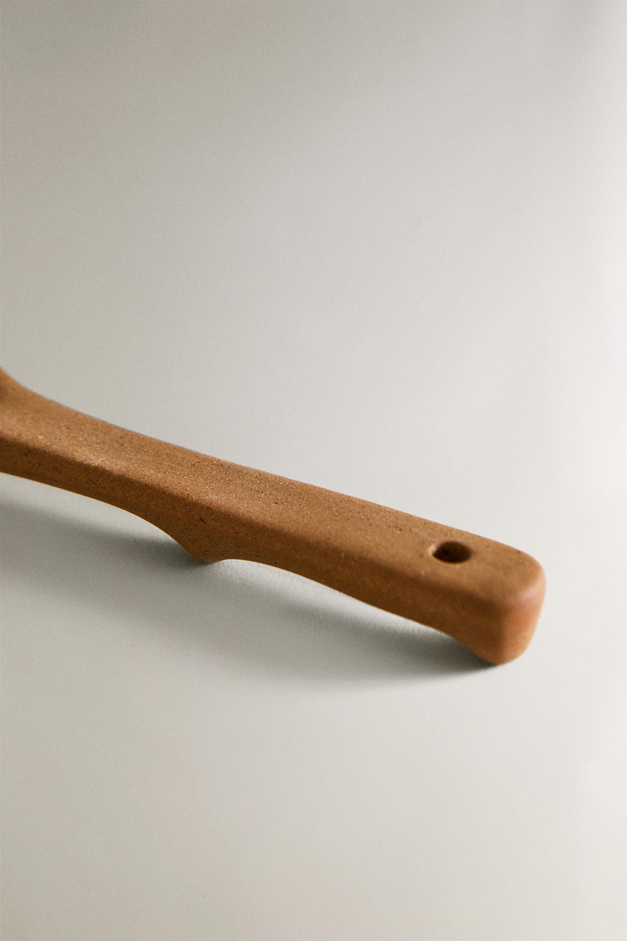 SPOON WITH RAISED DESIGN