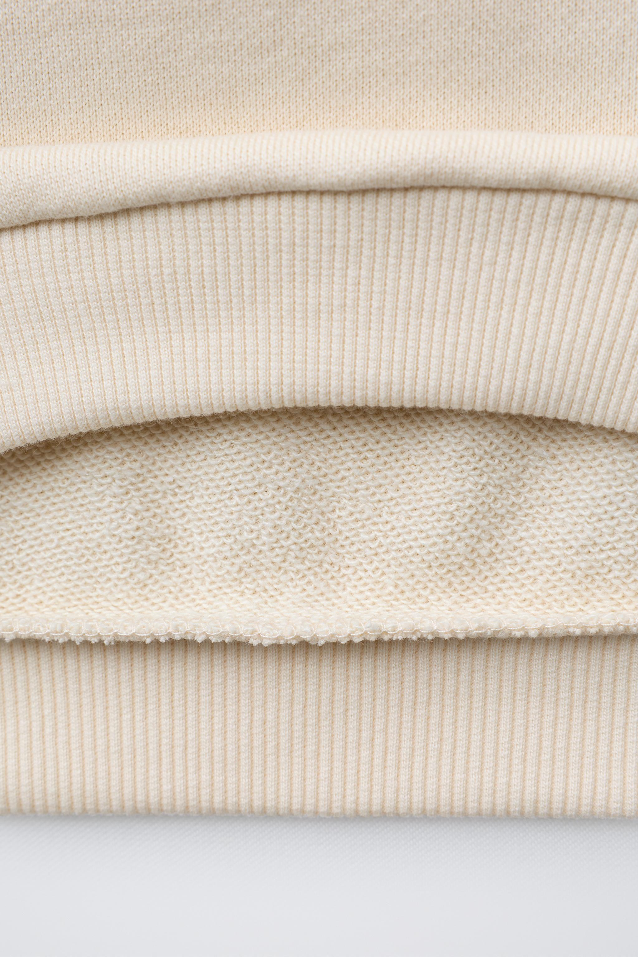 HEART POCKET SWEATSHIRT