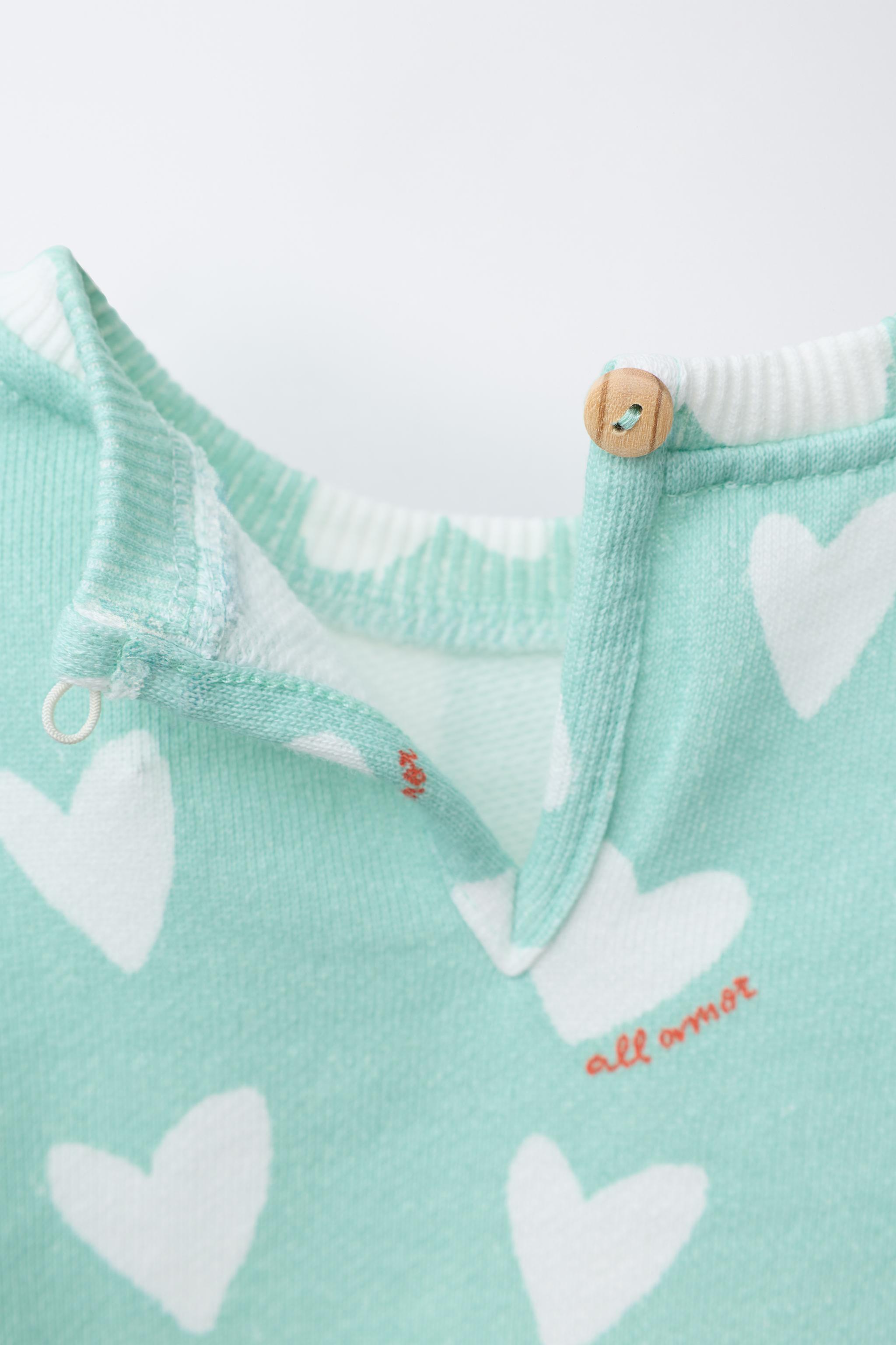 HEART PRINT SWEATSHIRT