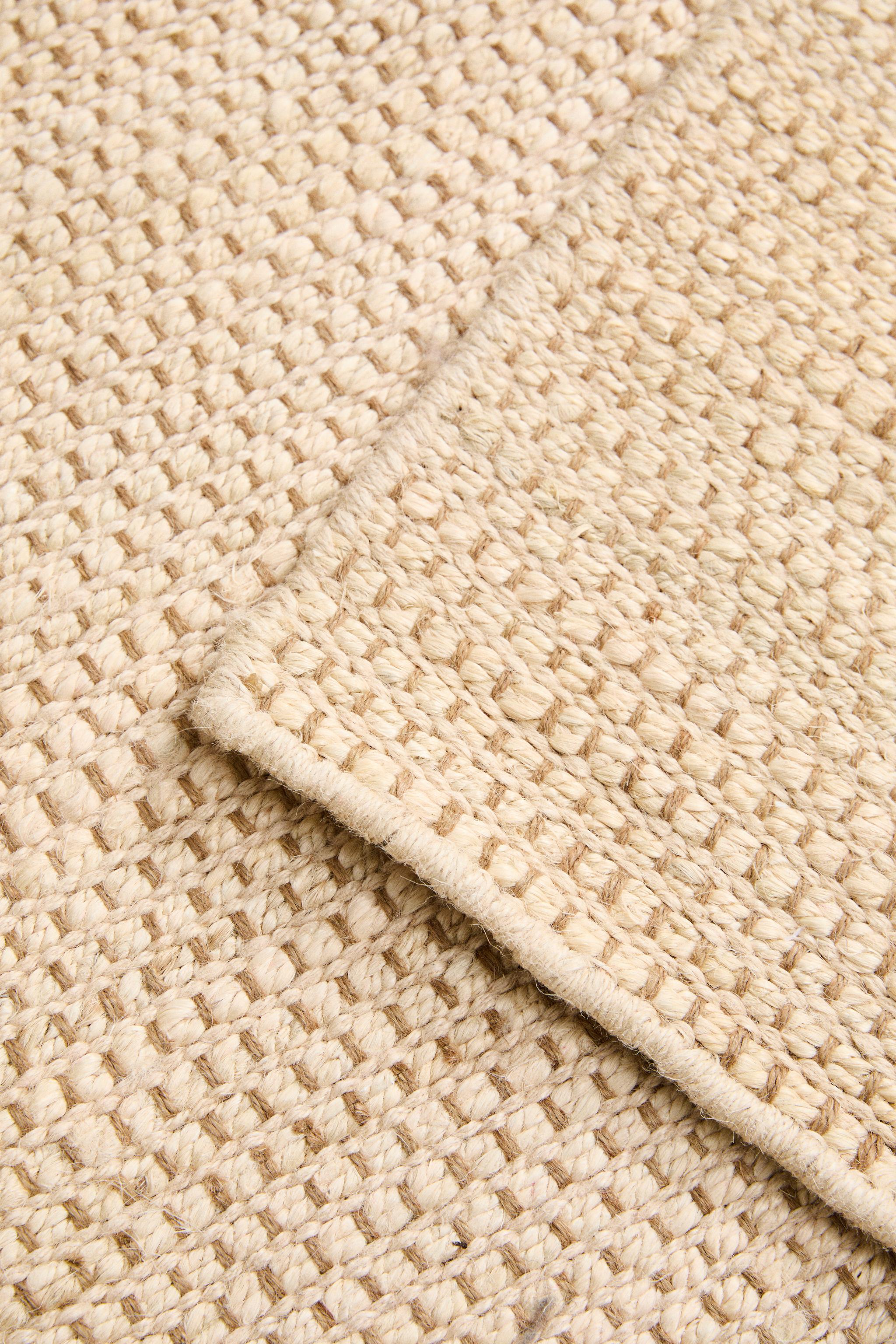 WOVEN JUTE AREA RUG