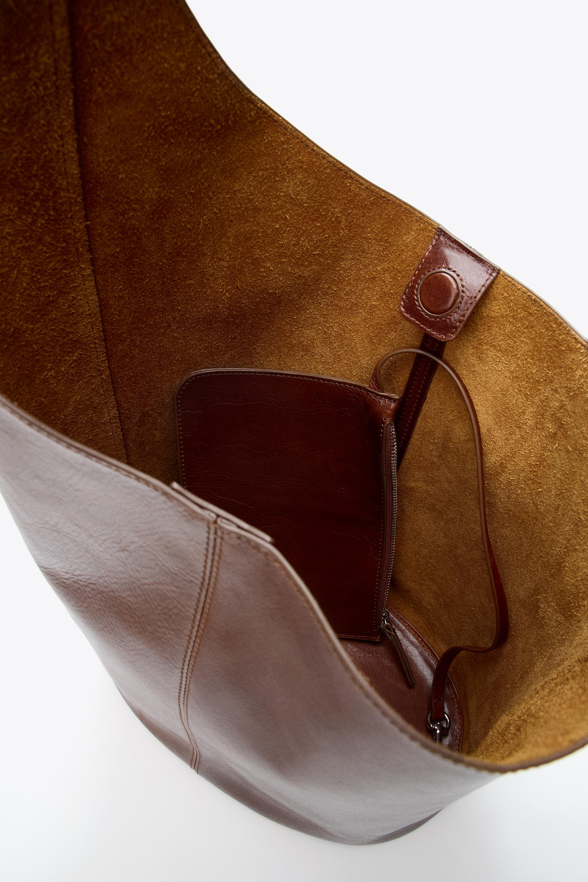 ASYMMETRIC LEATHER BUCKET BAG