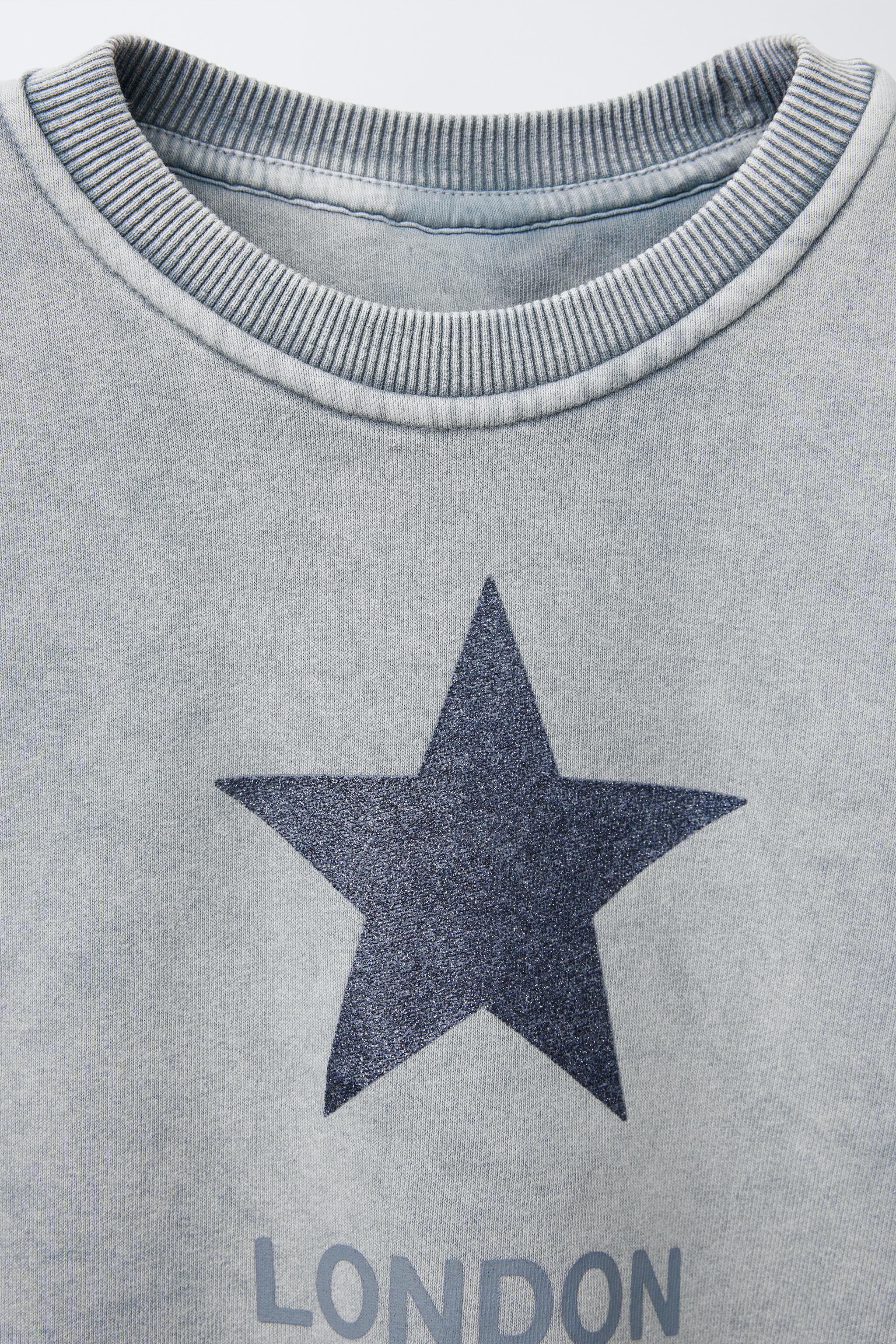 WASHED EFFECT GLITTER STAR SWEATSHIRT