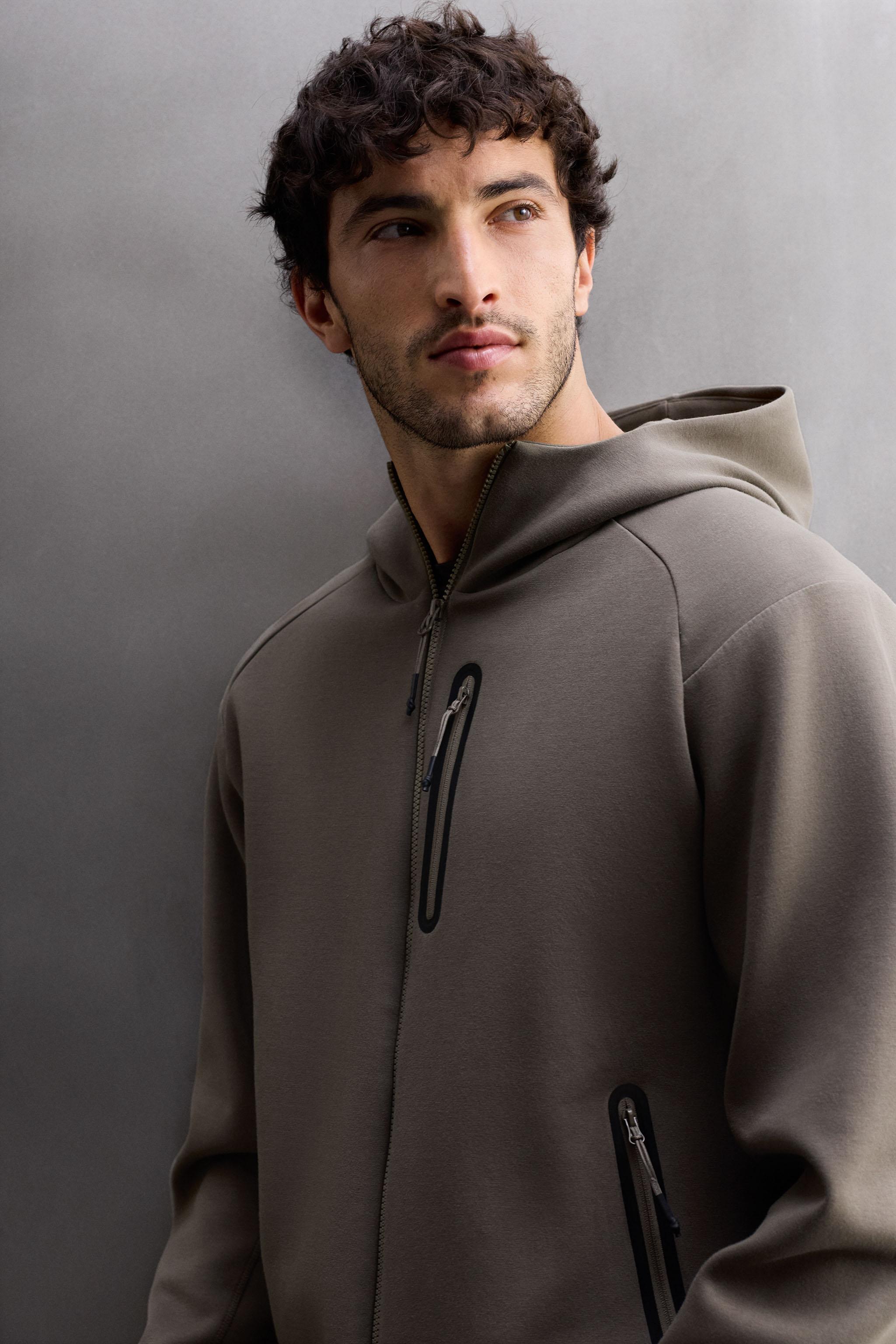 TECHNICAL ZIP-UP HOODIE