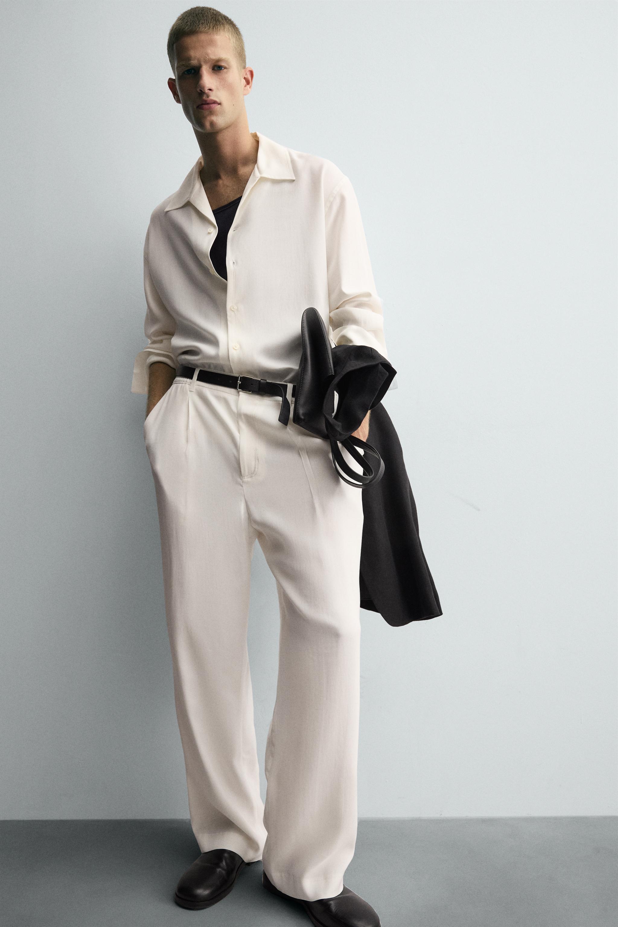 RELAXED FIT PLEATED PANTS