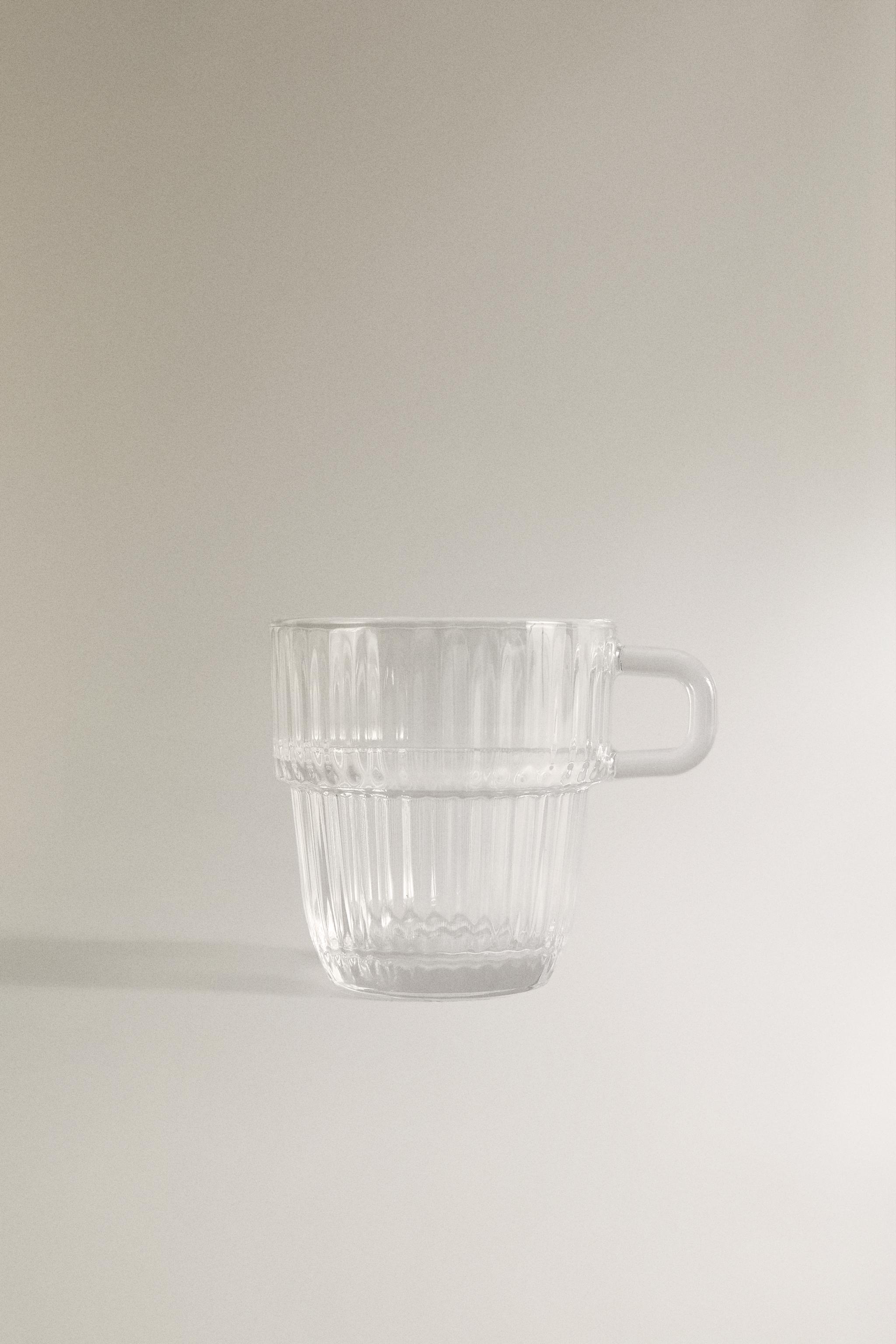 GLASS CUP WITH RAISED DESIGN