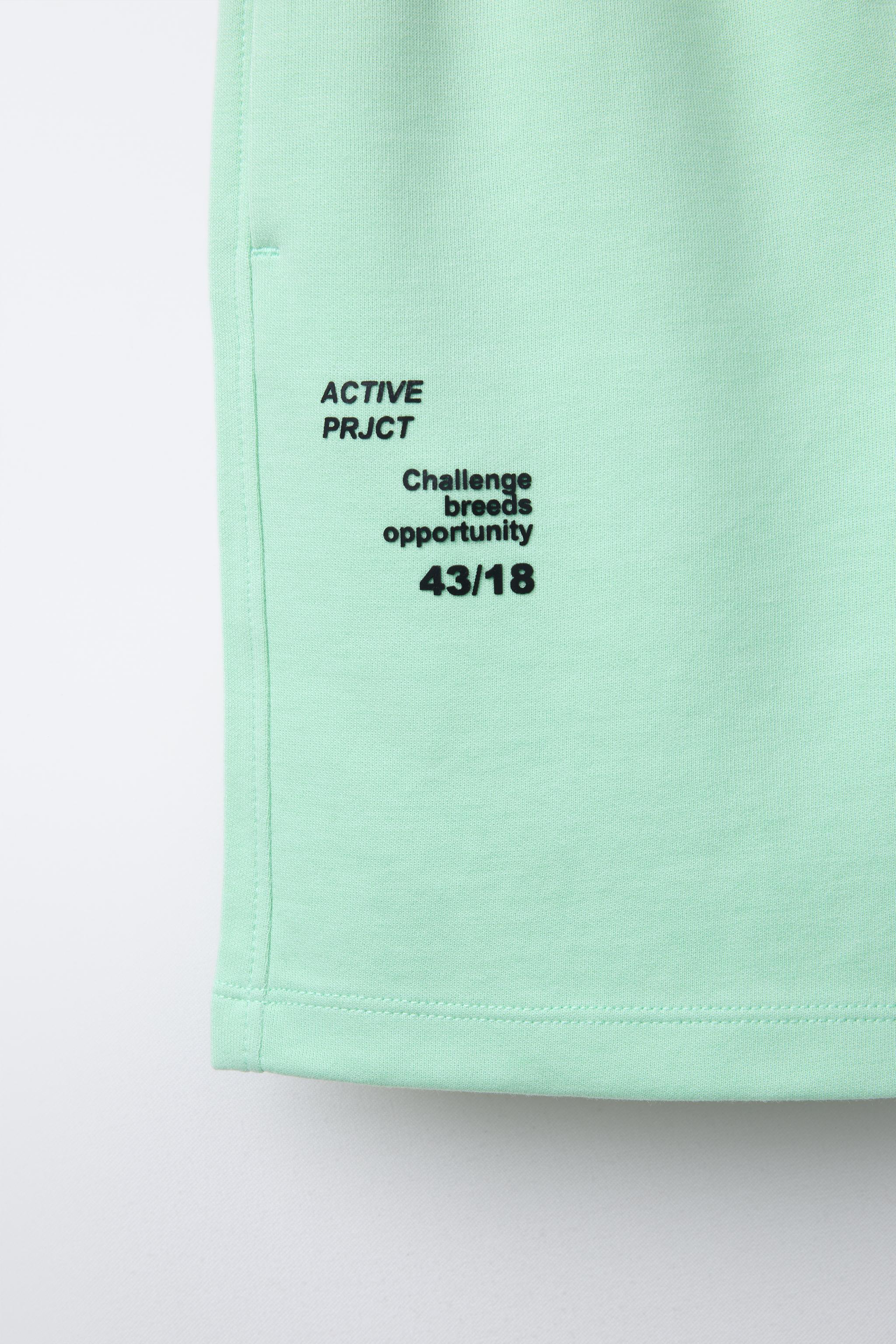 ATHLETIC SHORTS WITH RAISED TEXT