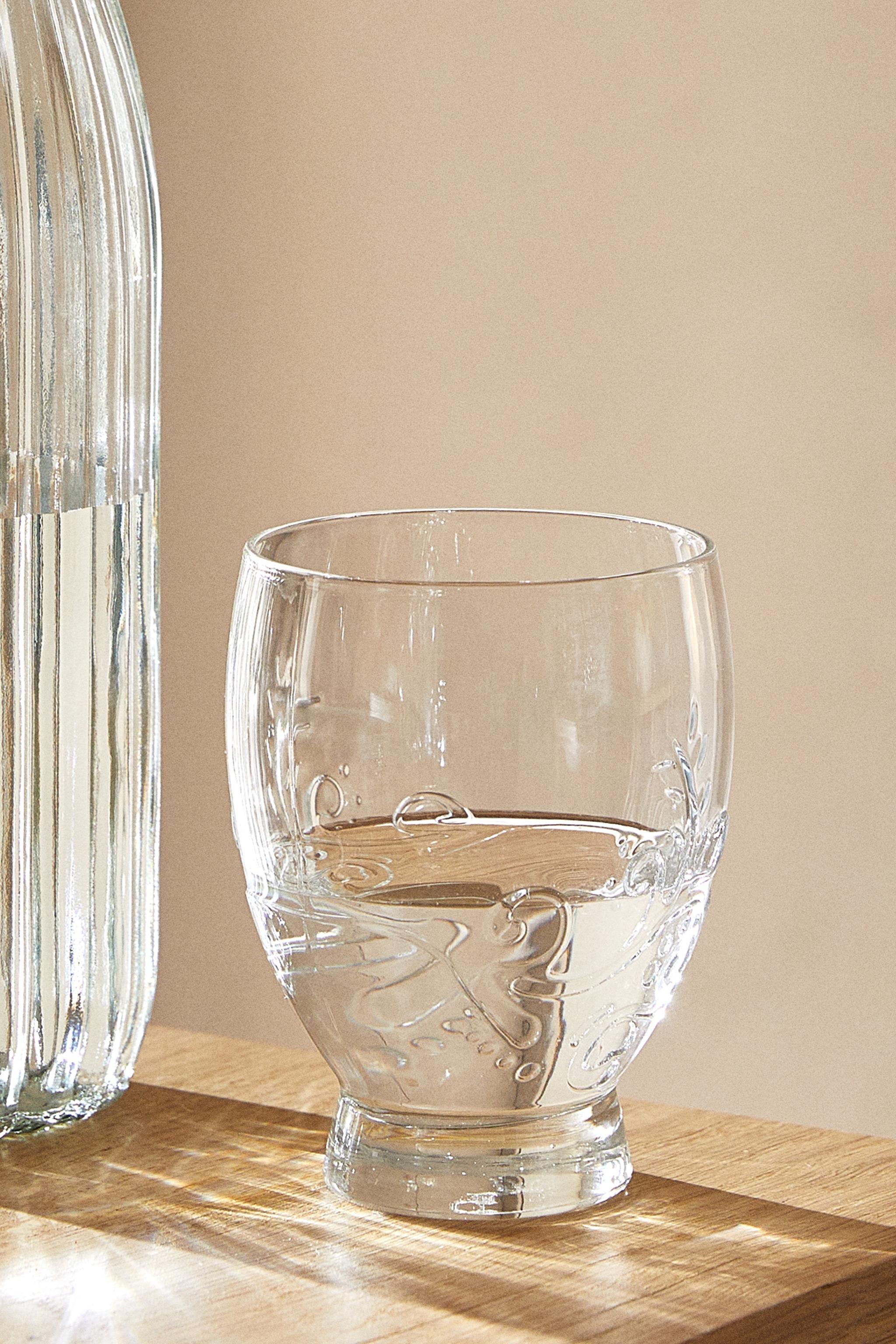 RAISED FLORAL DESIGN GLASS TUMBLER
