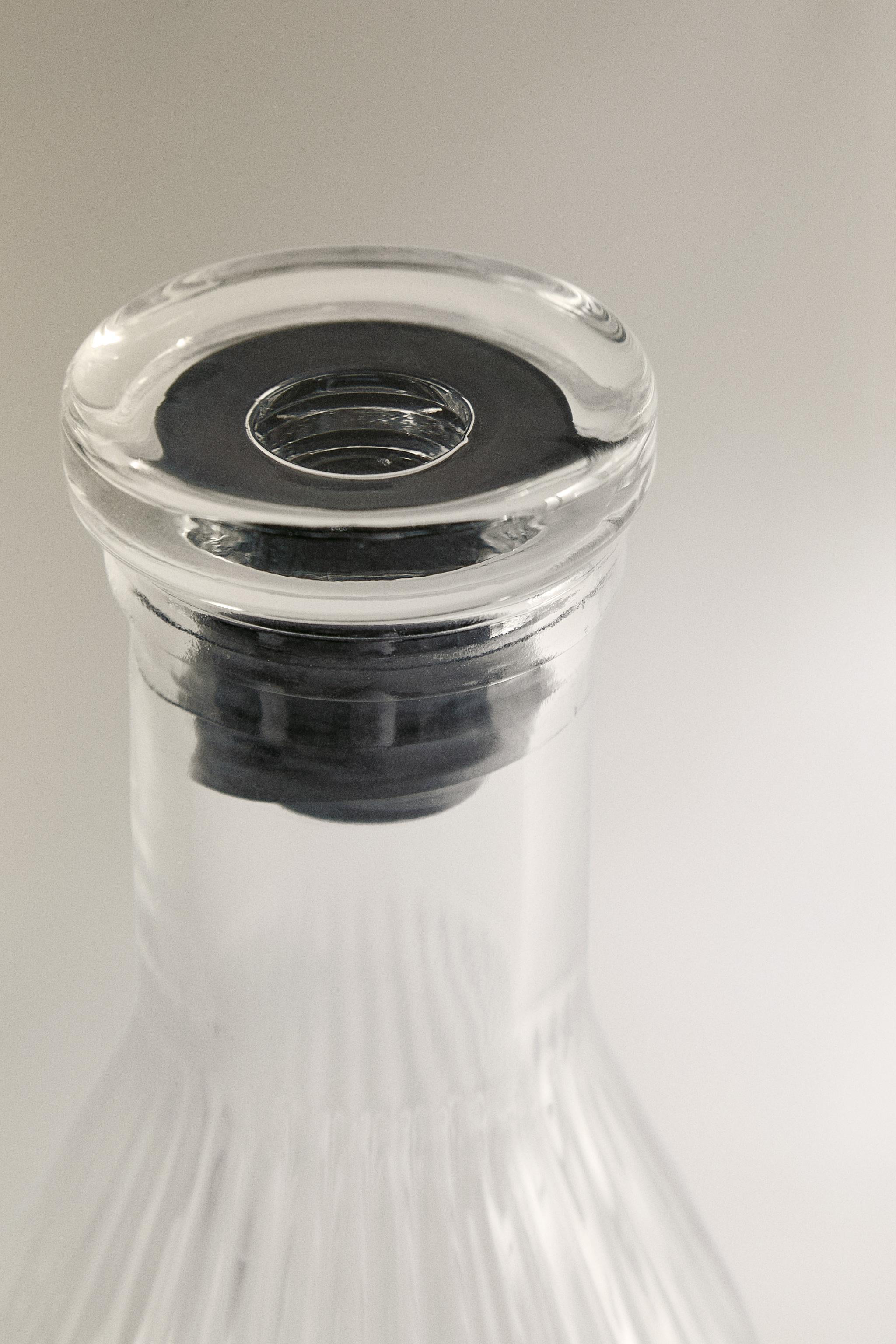 RAISED DESIGN GLASS BOTTLE