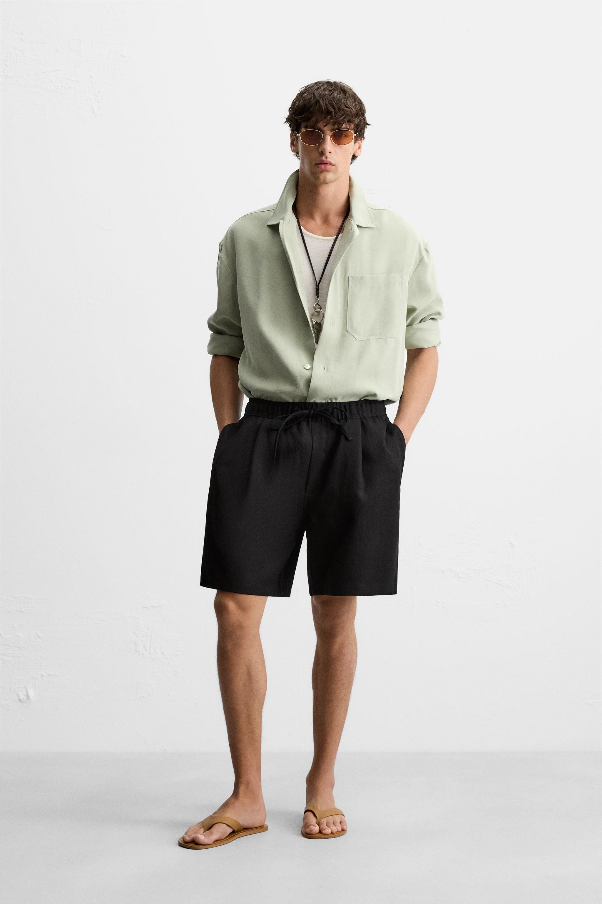 PLEATED FLOWY SHORTS