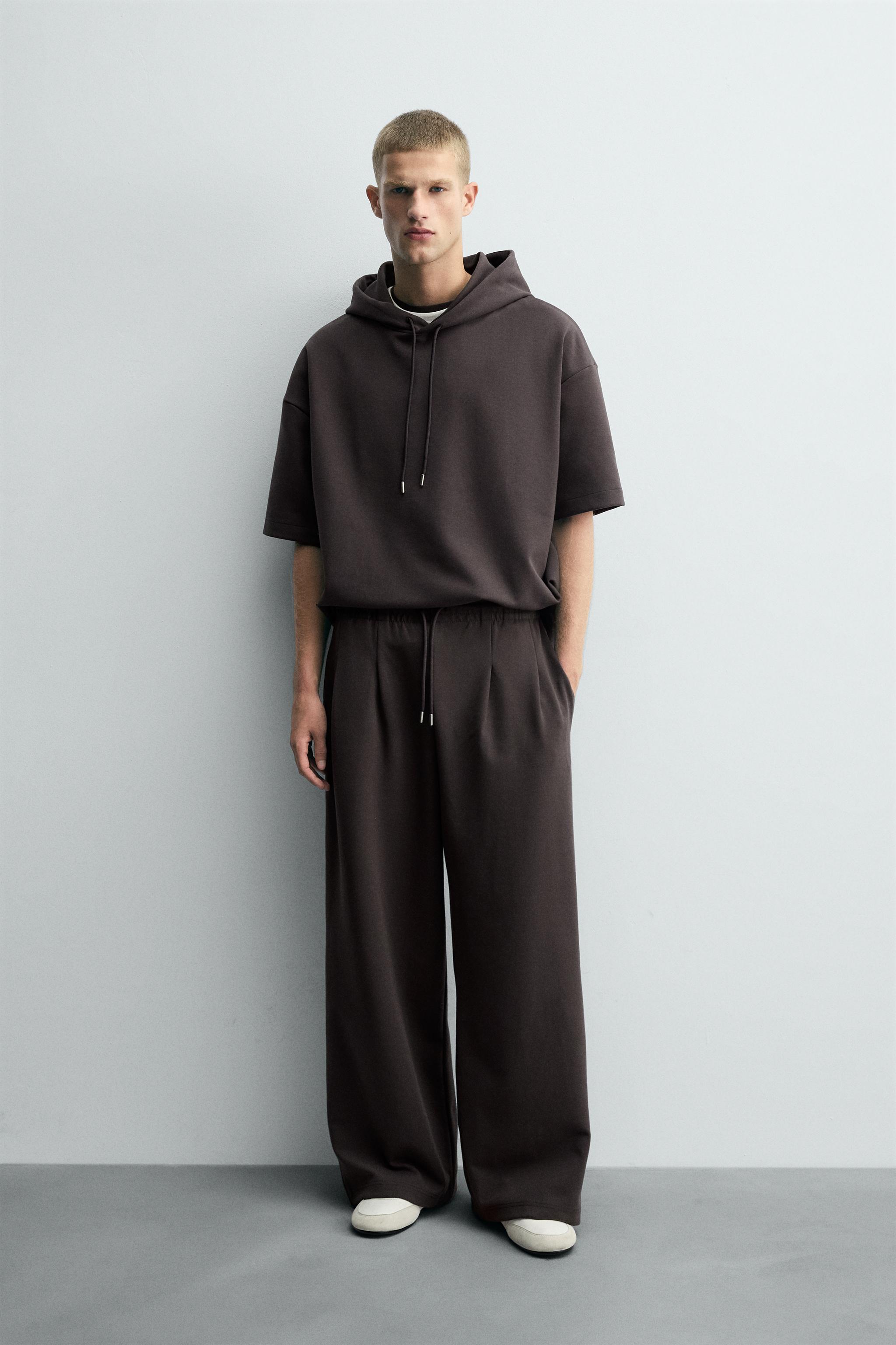 INTERLOCK PLEATED LABEL PANTS