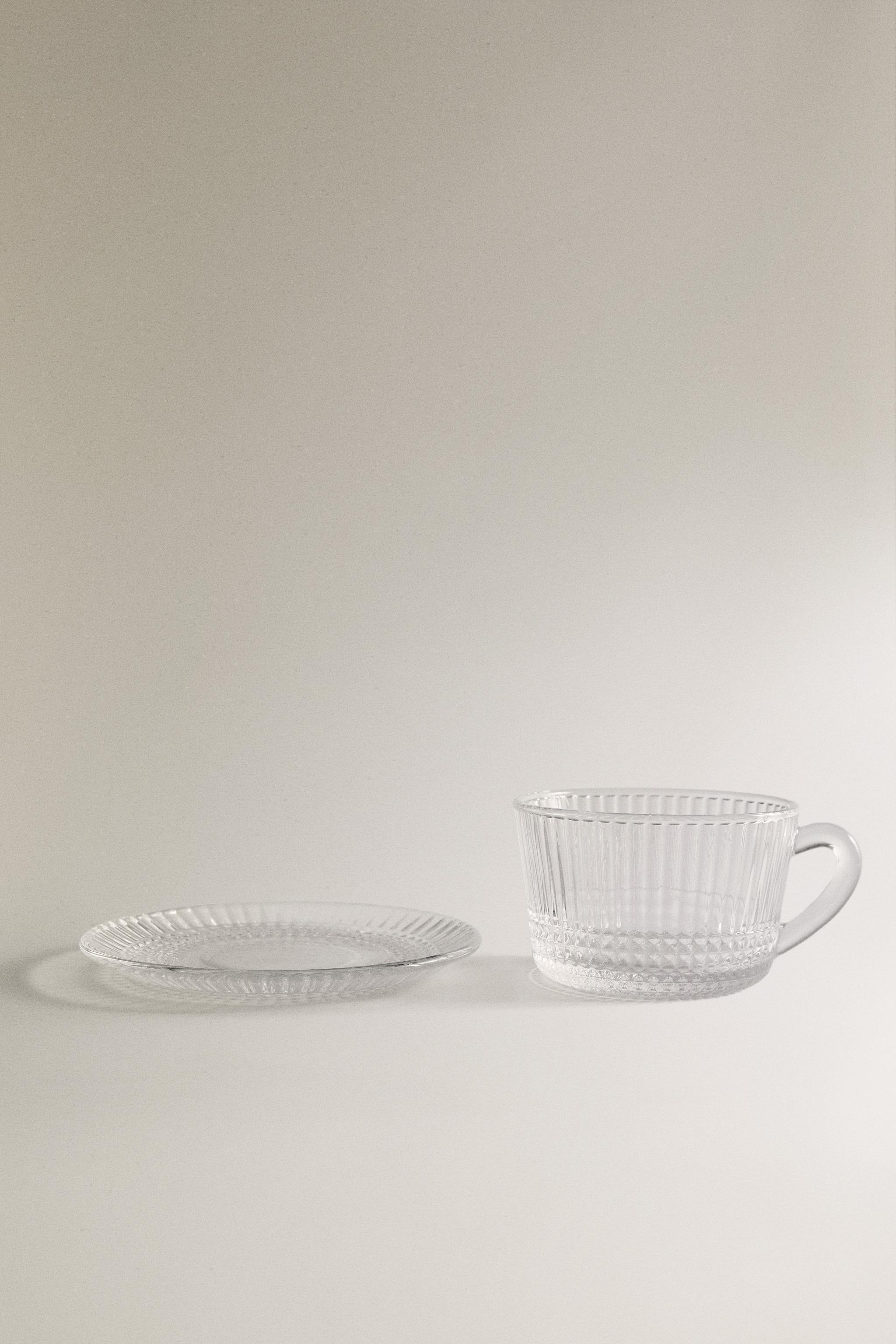 GLASS TEACUP WITH RAISED GEOMETRIC DESIGN