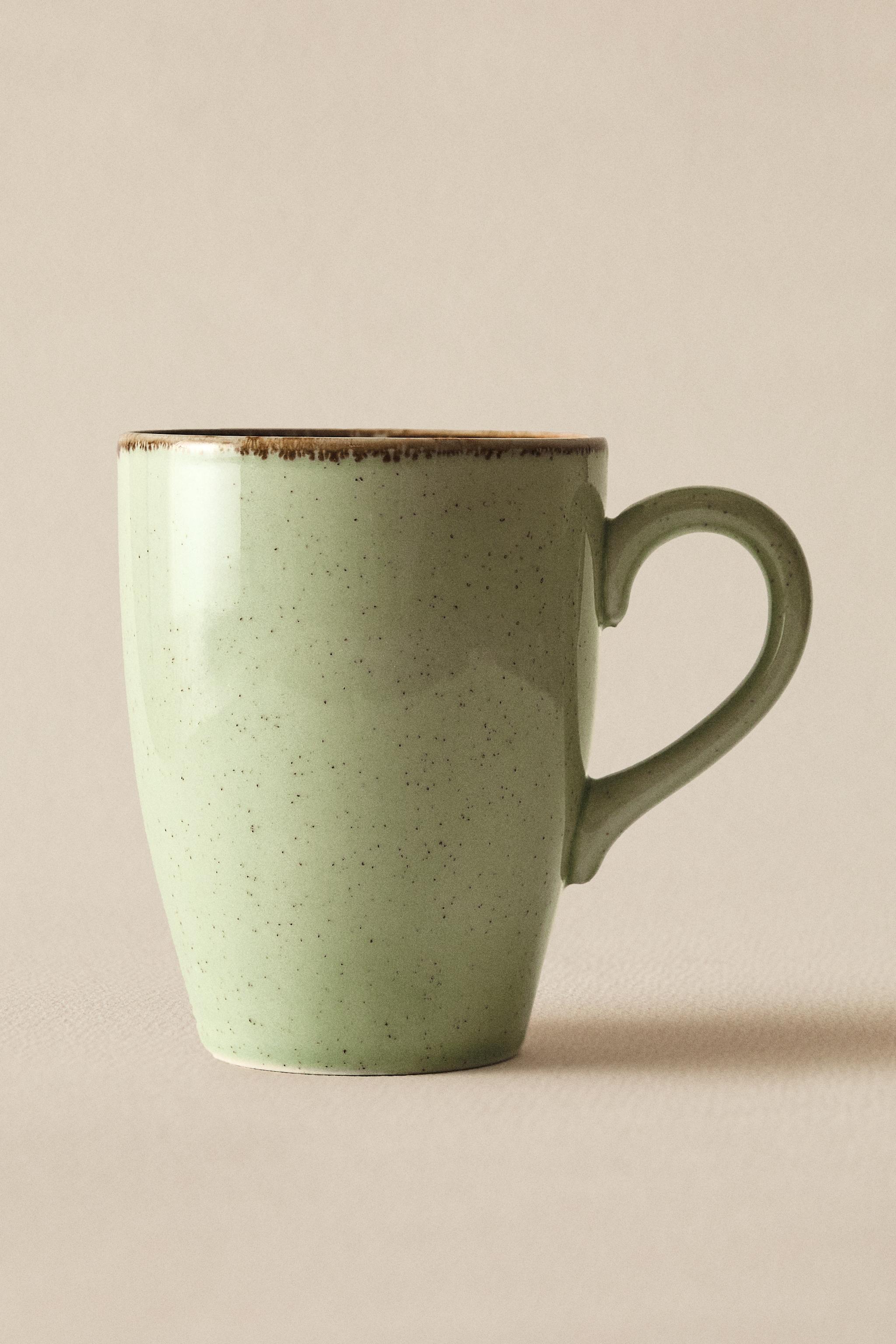 PORCELAIN MUG WITH ANTIQUE FINISH RIM