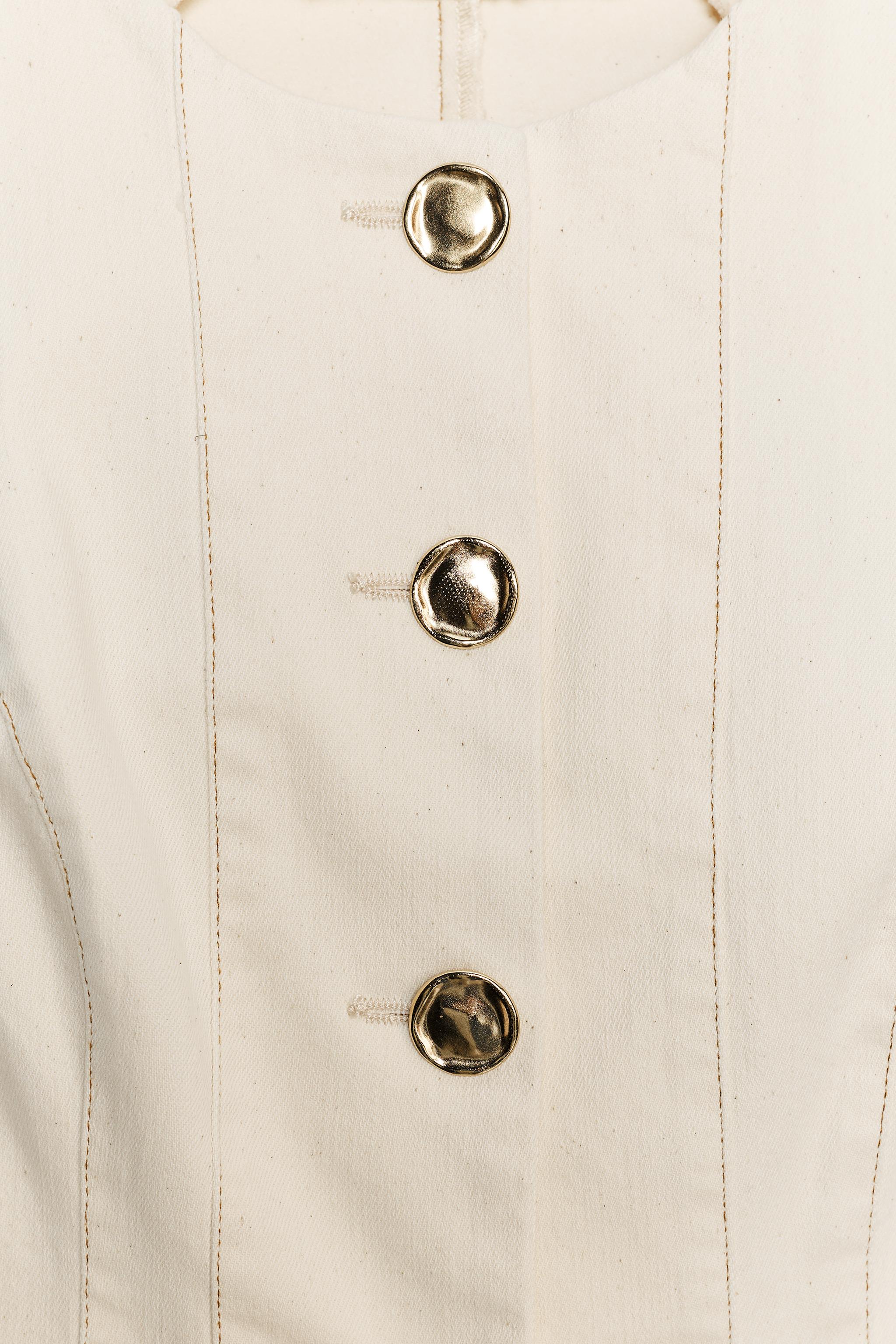 STITCHED PEPLUM VEST