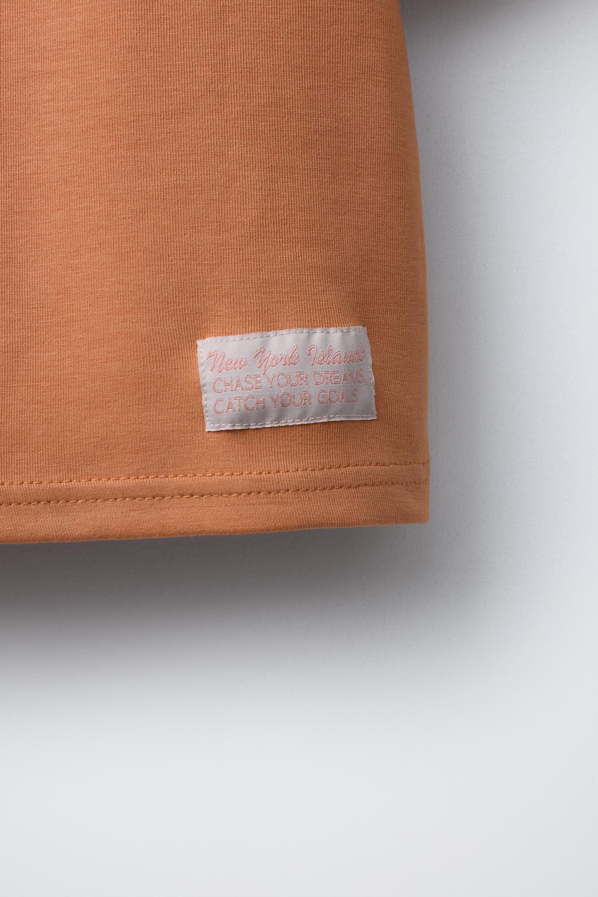 INTERLOCK TEXT T-SHIRT