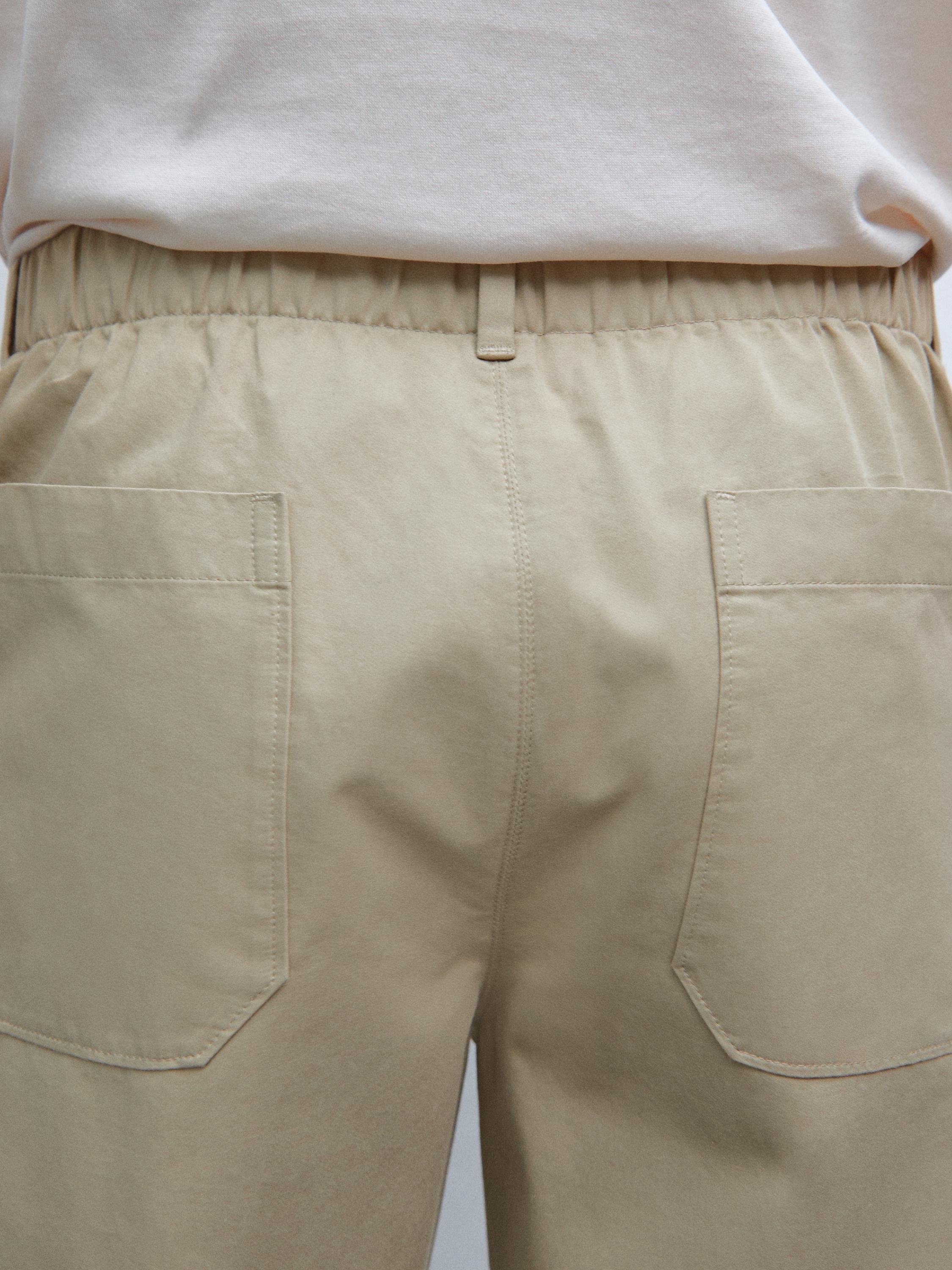 Trousers with patch pocket