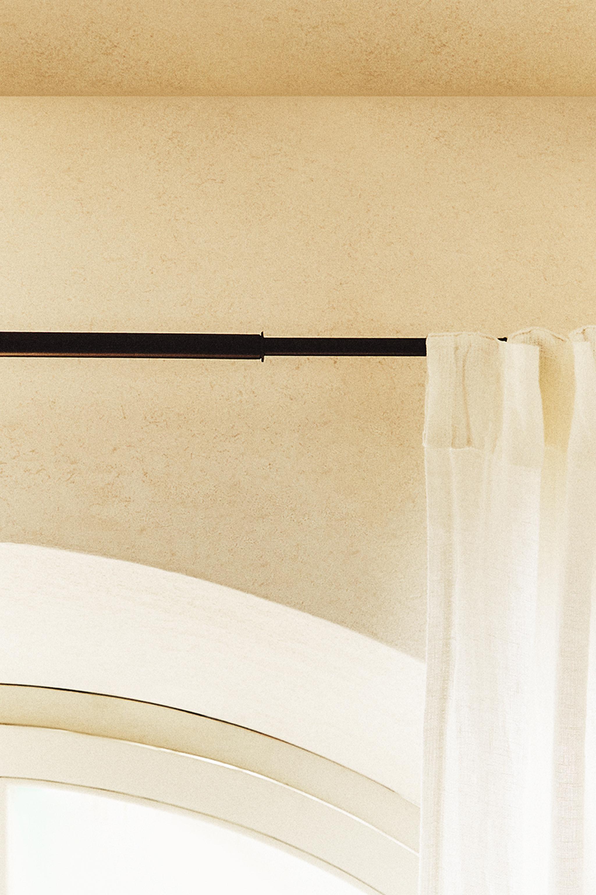 EXTENDIBLE METALLIC CURTAIN RAIL